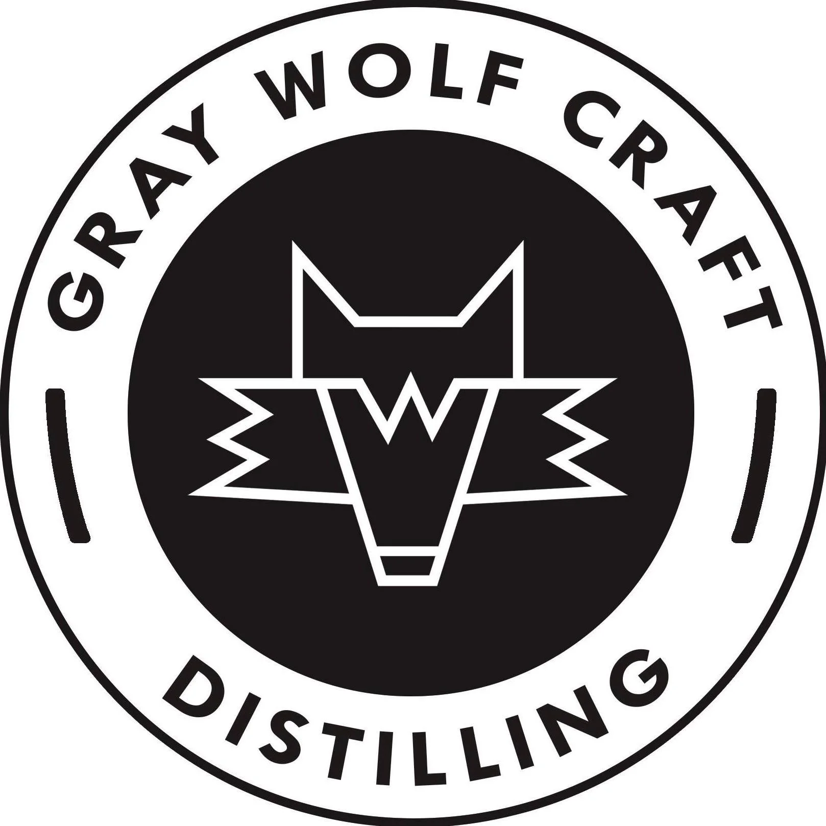 Circular logo with a wolf's head outline in the center, surrounded by the text 'GRAY WOLF CRAFT DISTILLING'.