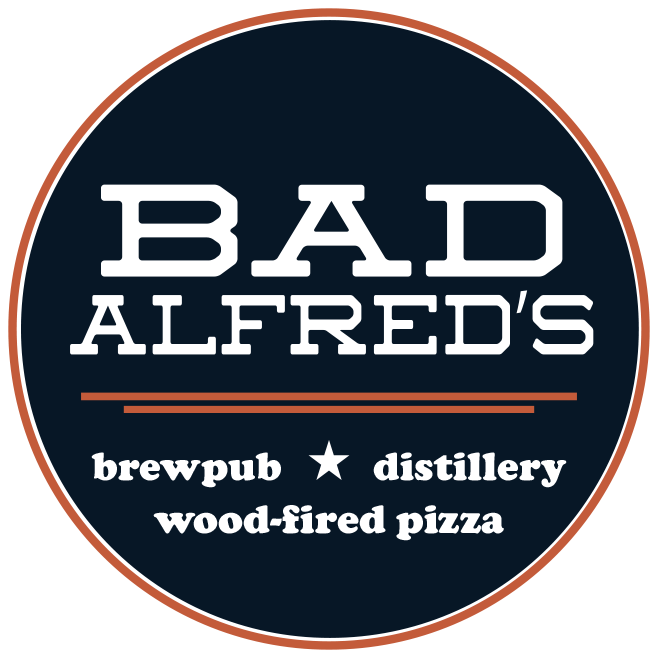 Logo for Bad Alfred's featuring text for brewpub, distillery, and wood-fired pizza on a dark circular background with a thin border.