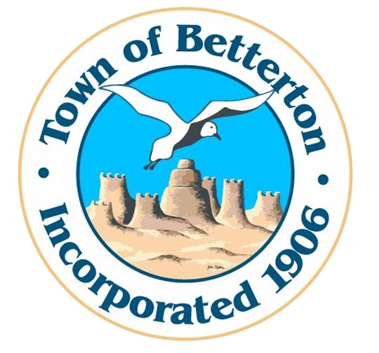 The logo for Town of Betterton, established in 1906, features a seagull flying over a sandy beach with an old sandcastle in the background, and the town's name encircling the image.