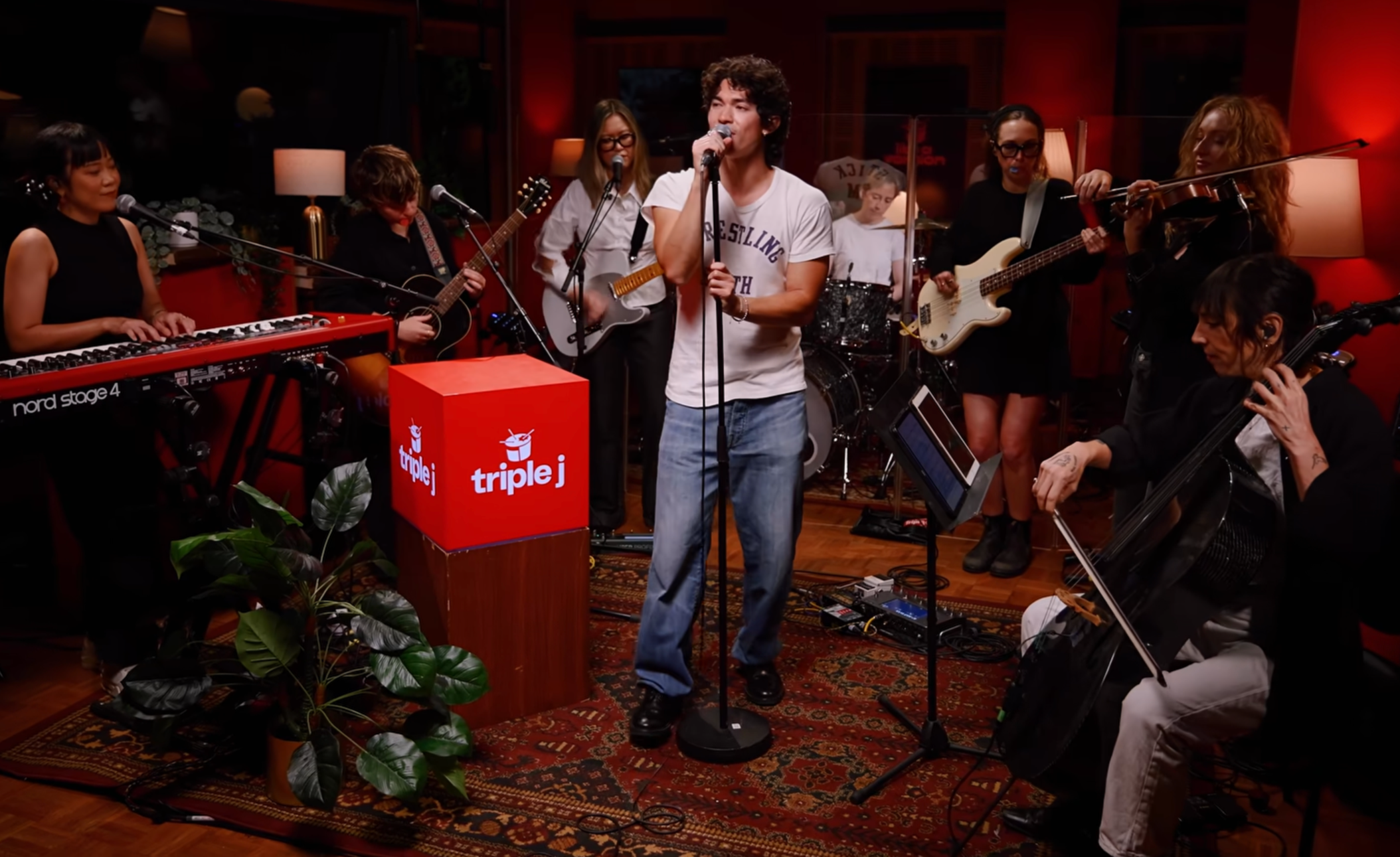 tiana ohara performing guitar and background vocals with conan gray and all female band in the triple j studios for like a version