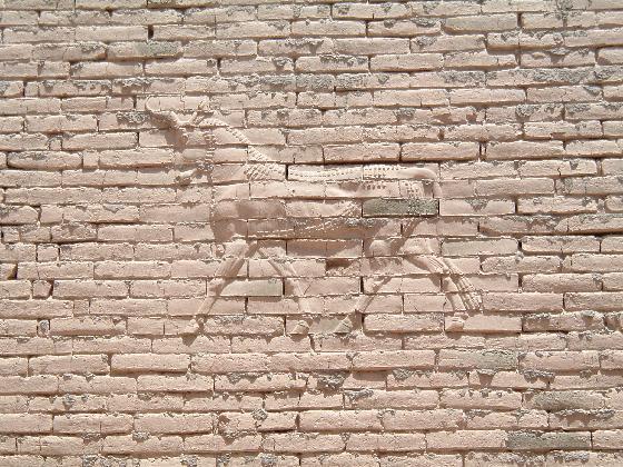 NICA-Persian-deific_relief_on_wall_facing_the_promenade-al_hillah.jpg