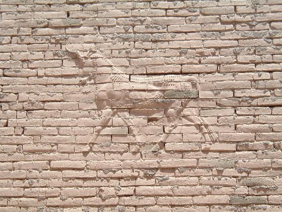 NICA-Persian-deific_relief_on_wall_facing_the_promenade-al_hillah.jpg