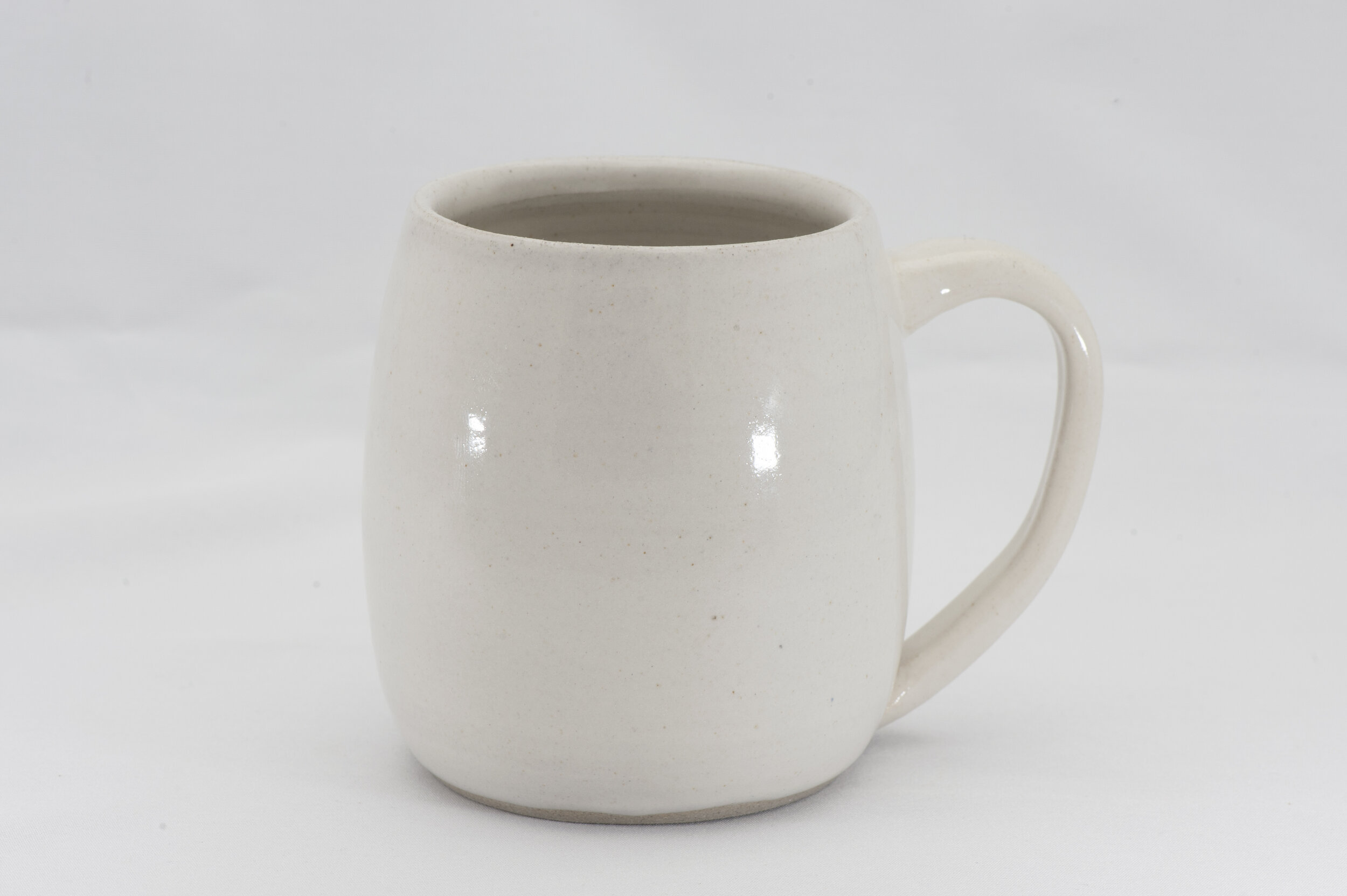 The mug handmade by KJ at Viva Clayworks