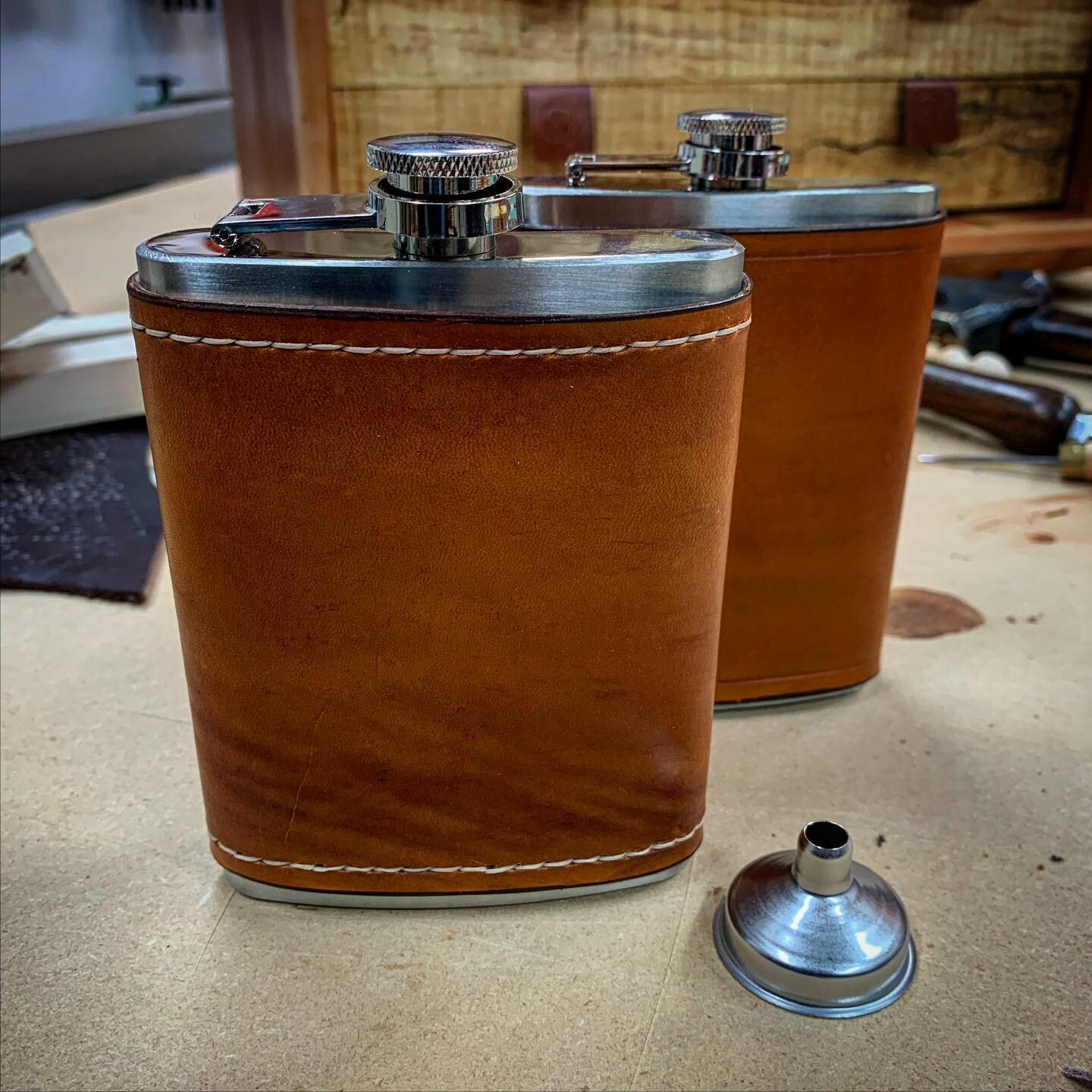 This year&rsquo;s Christmas makers gift was leather covered flasks. I made about 15 of them for various friends. Everyone loved them. I didn&rsquo;t do the stitching on them except for this last one. Opinions on which one is better? #leather #leather