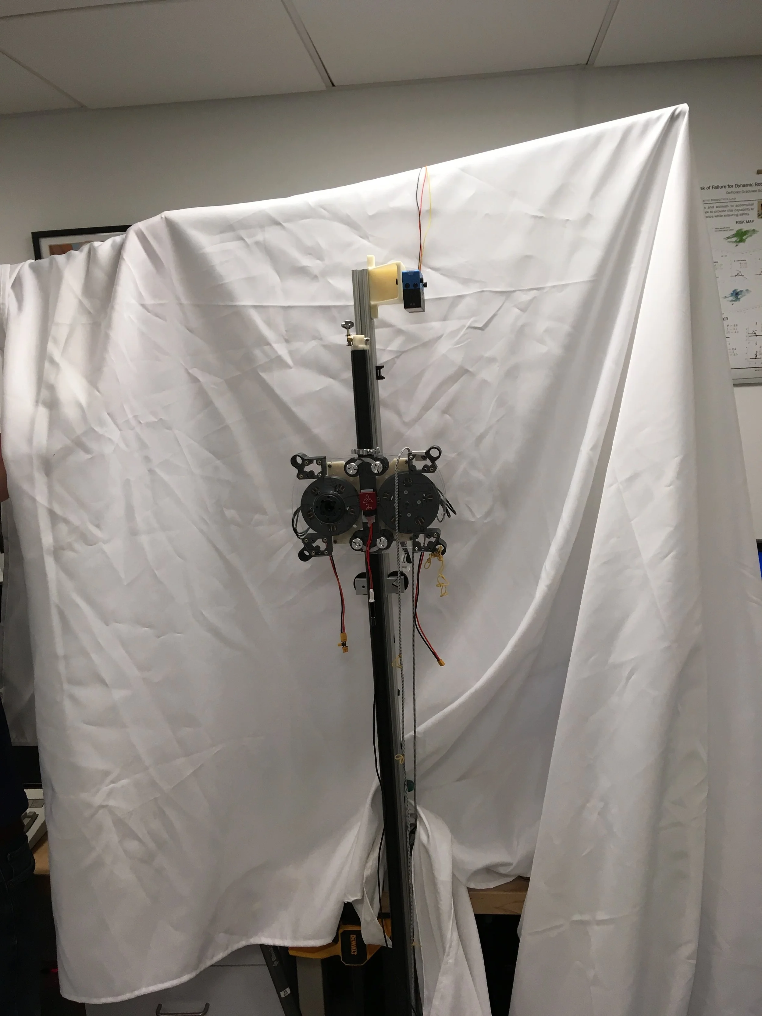 We designed and built a robot to test a planner and controller which directly minimizes the theoretical risk of failure for each step.