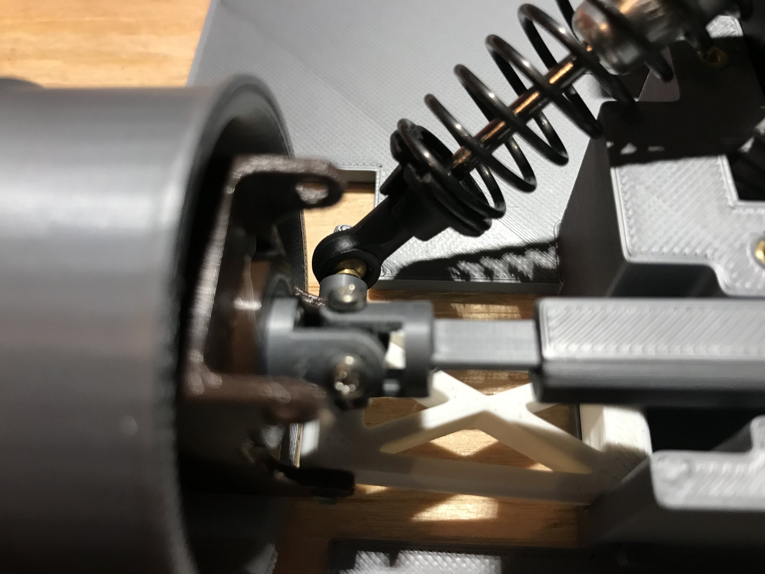 Rear end universal joint and suspension linkage