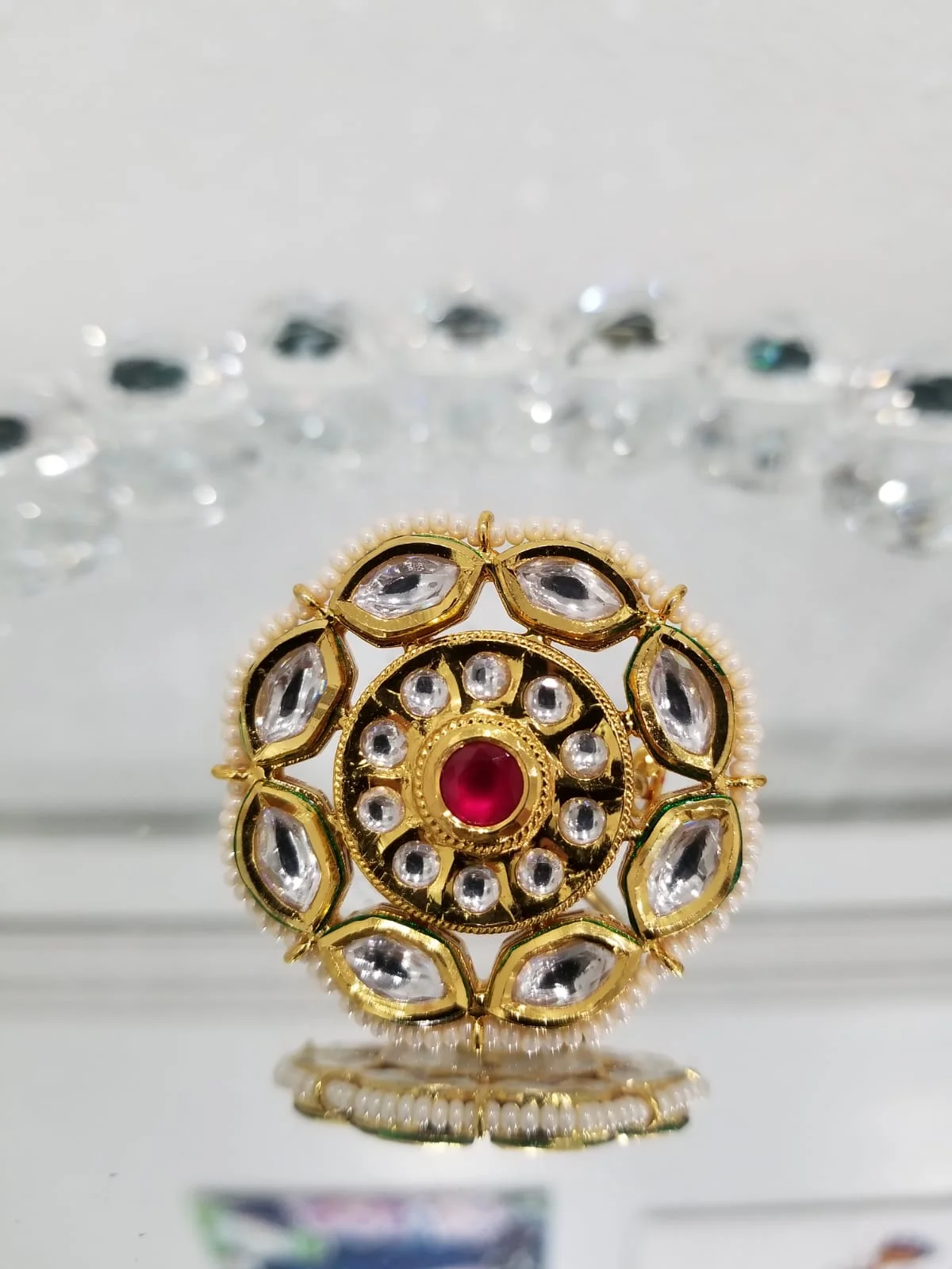 Round Kundan Ring with a Ruby Colored Crystal 