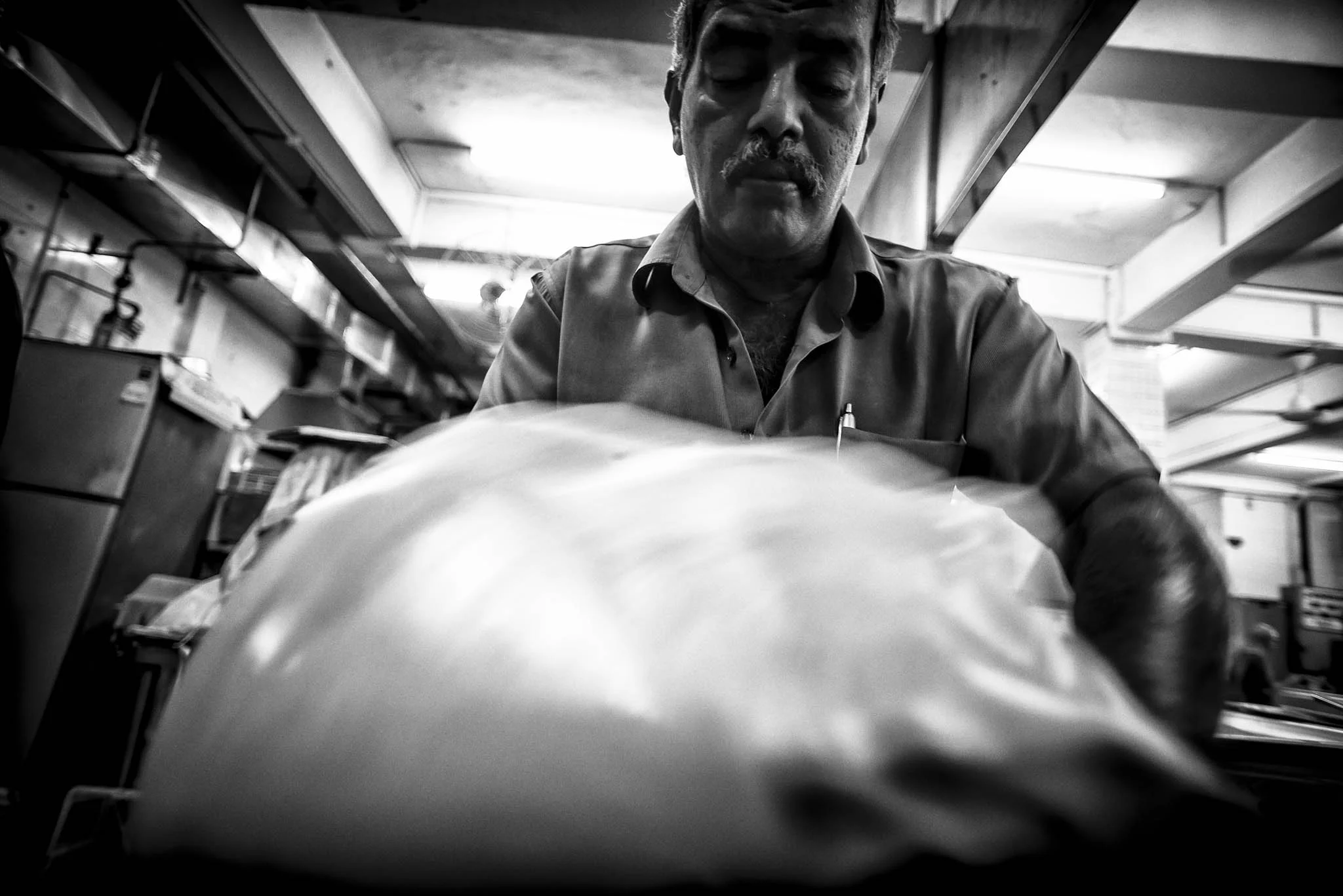 Mr Mohgan is on his feet flipping hundreds of roti pratas every day, and takes only one or two breaks during this marathon-like routine which begins 6am daily.