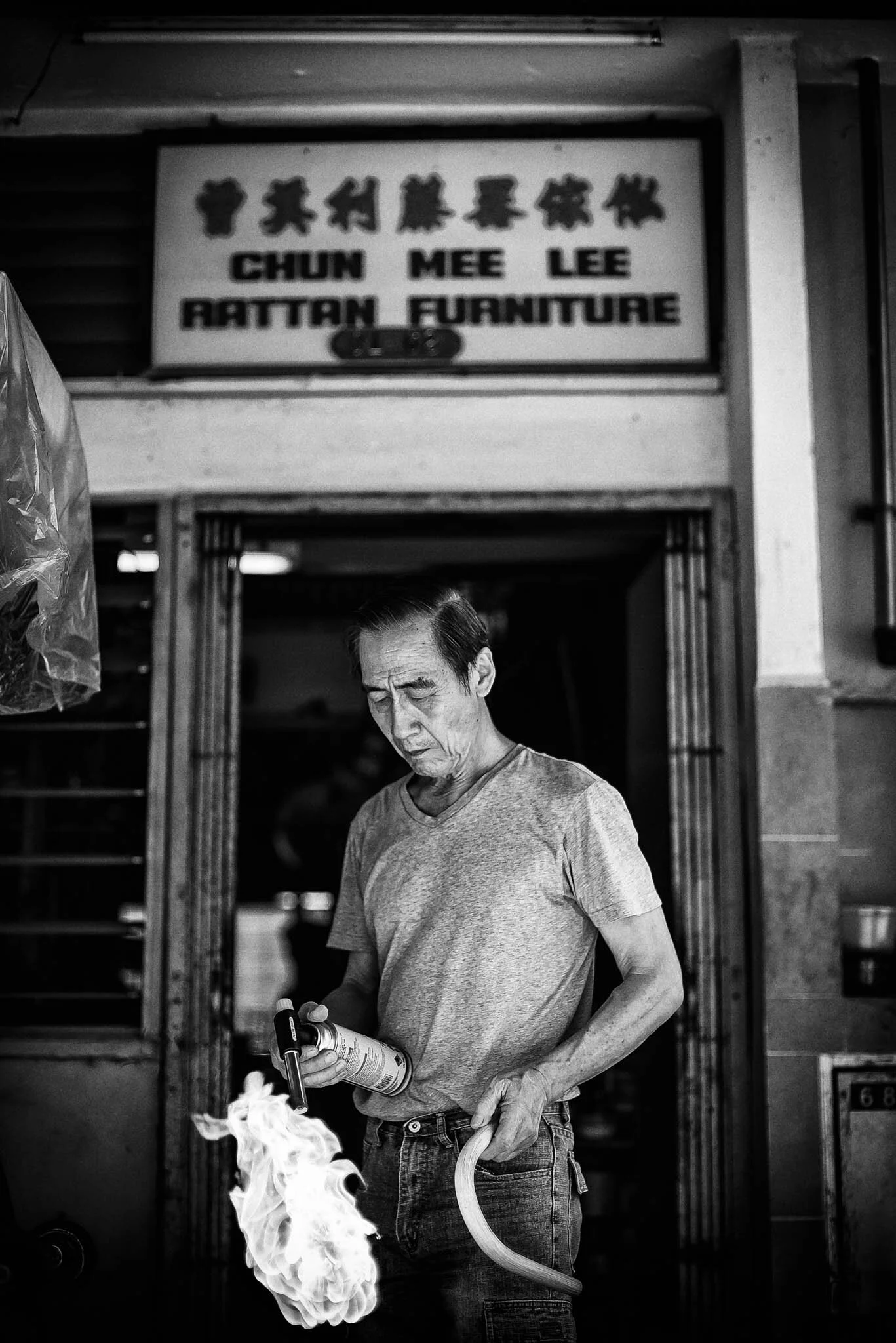 Mr Chen uses a burner to soften thick rattan so that he can bend them into various shapes. Once cooled, the rattan hardens,