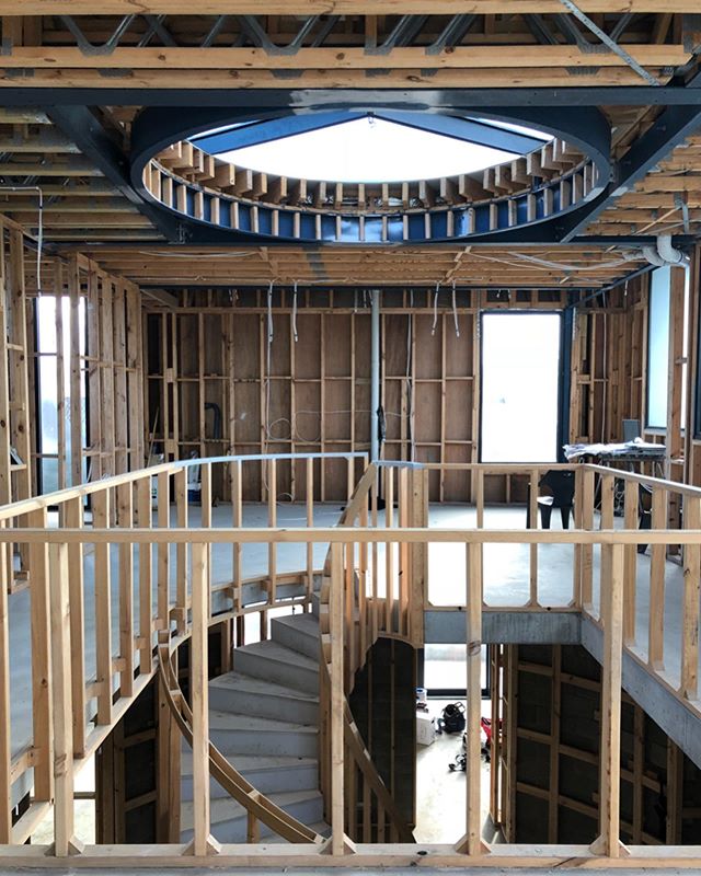 Looking across the spiral staircase towards the kitchen at our Brighton rough in today. Plenty more km&rsquo;s of cable need to go into this one before completion!
