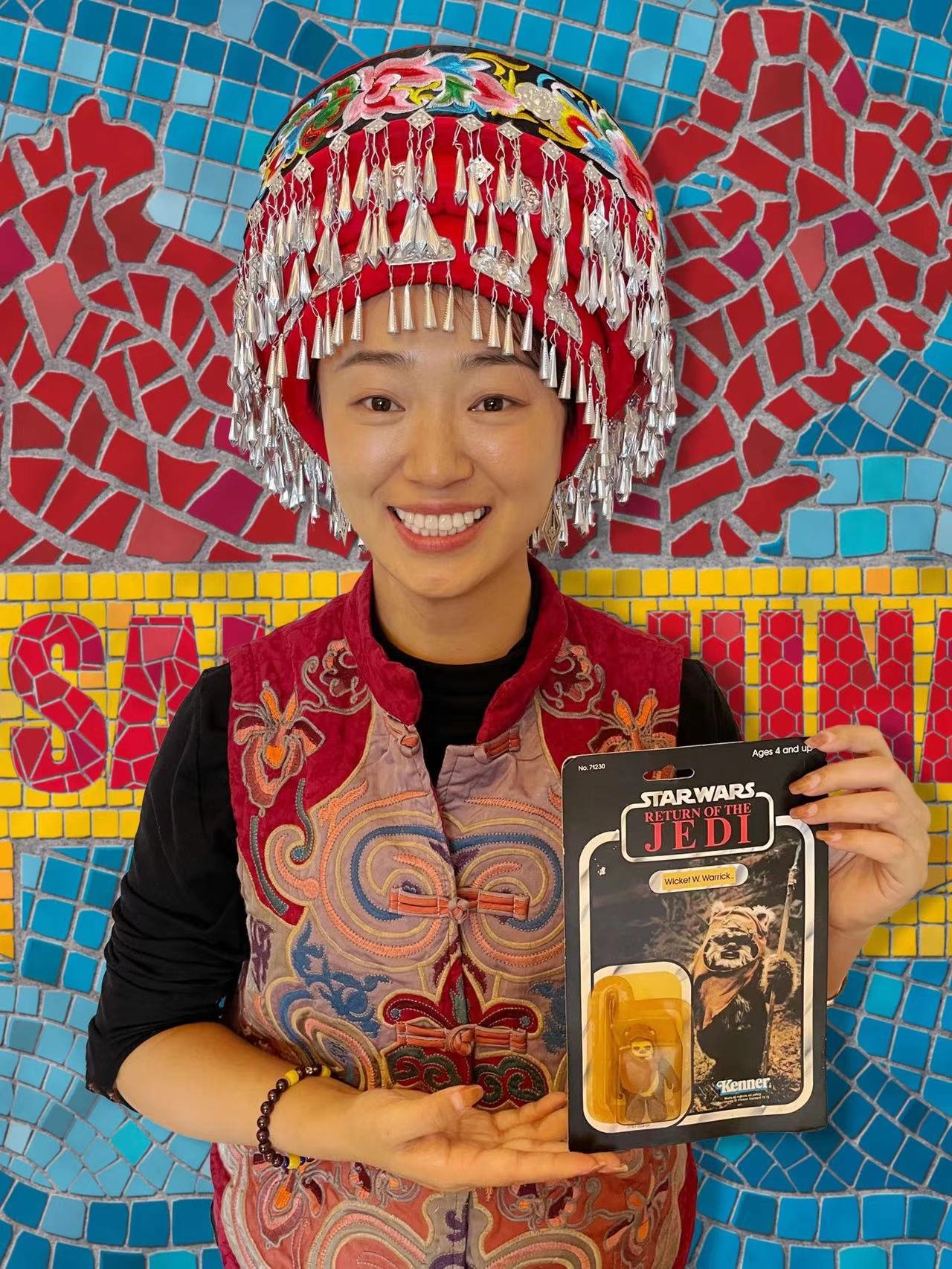 Ashley Huang’s two objects: A figurine of Wicket and a 土家 [Tǔjiā] headdress.