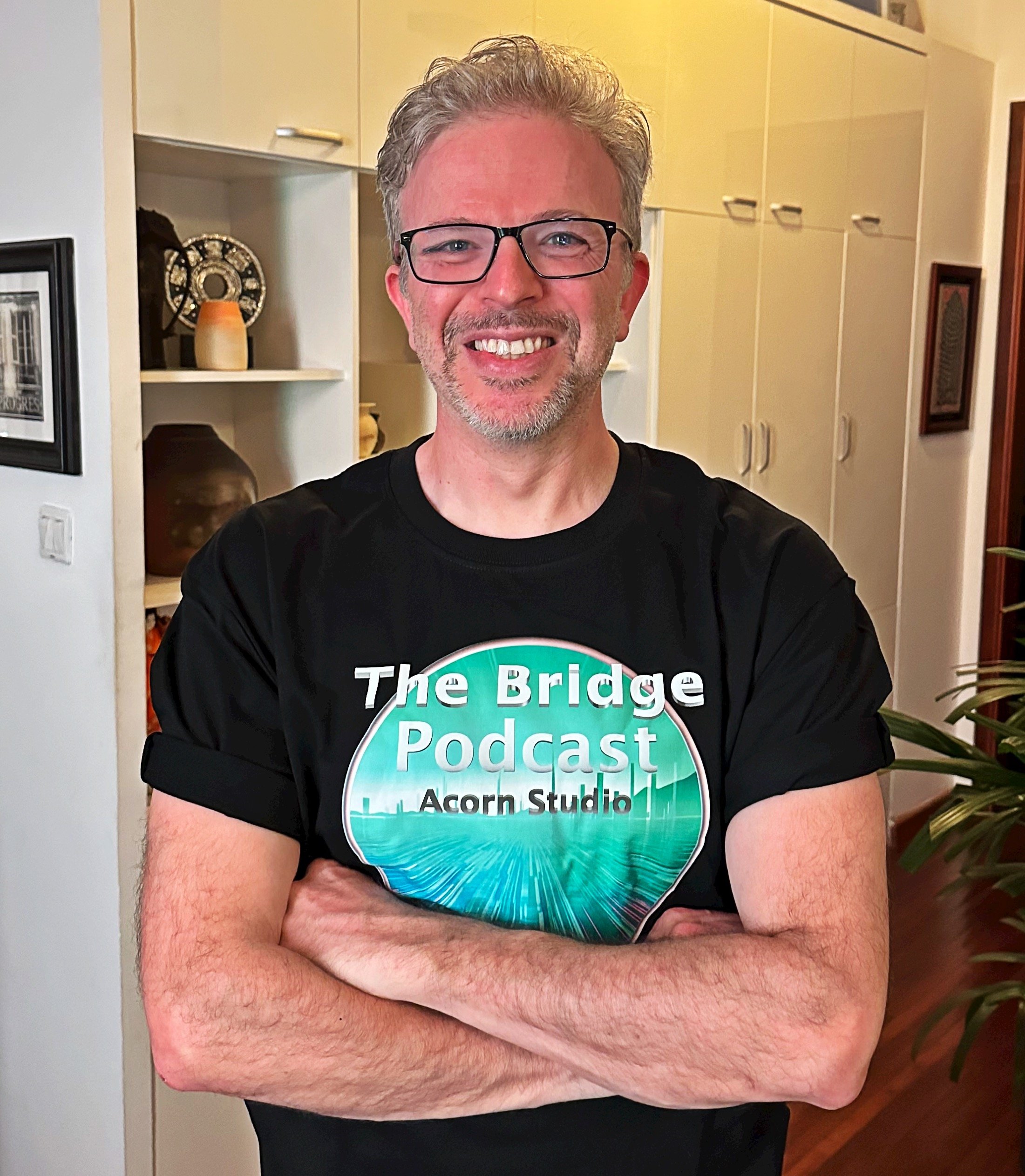 A photo of Oscar posing in some excellent merch from The Bridge.