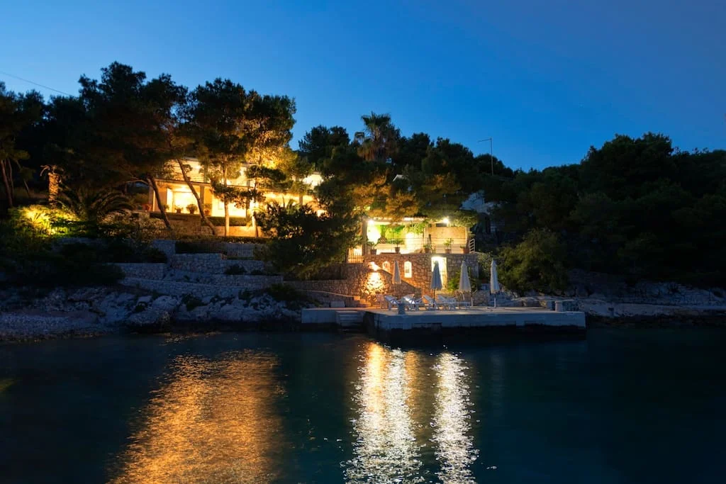 Villa-Oceanus-Outdoor-Night-View-From-Sea-002.jpg