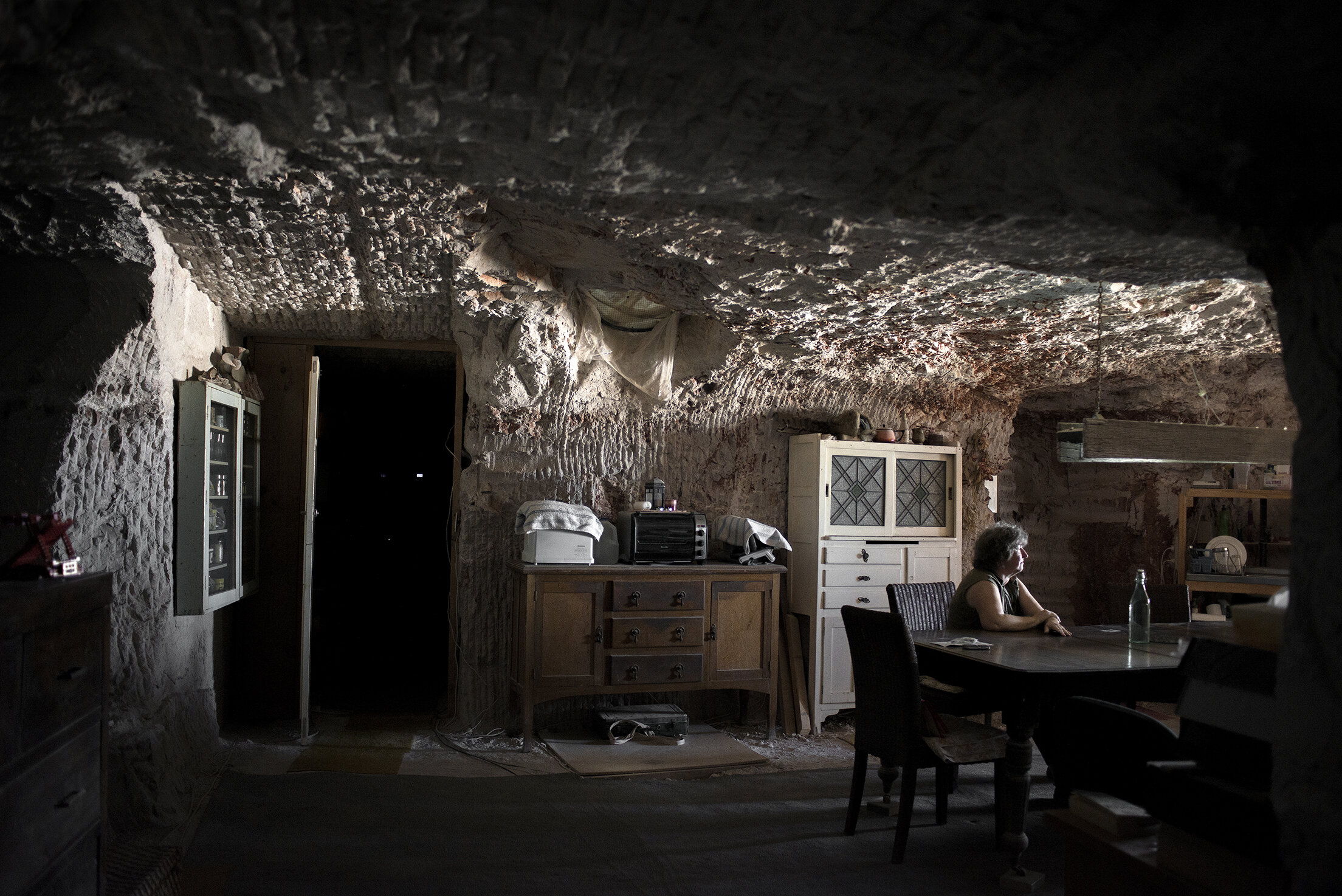  Gabriele Gouellain, a German immigrant, waits in the kitchen for her husband to return from mining. According to the Coober Pedy district council, a small town in the southern Australian outback, about 60 percent of the town's residents are original