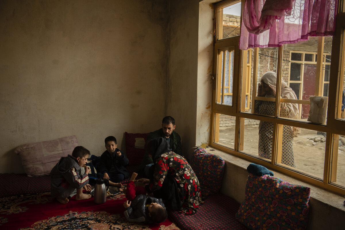  Members of Khaled’s family eat breakfast in their uncle’s home in their hometown of Parwan, Afghanistan, on March 23, 2020. Since they arrived home, the youngest son has experienced flu-like symptoms. Some of the Sayedkhili children were born in Ira