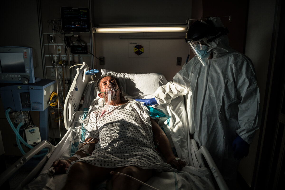  Leobardo Herrara, 59, struggles to breathe while using an oxygen mask in an improvised intensive care unit of Wycoff Heights Medical Center on April 25, 2020, with Dr. Parvez Mir, a pulmonologist by his side. Herrara lives a few blocks from the hosp
