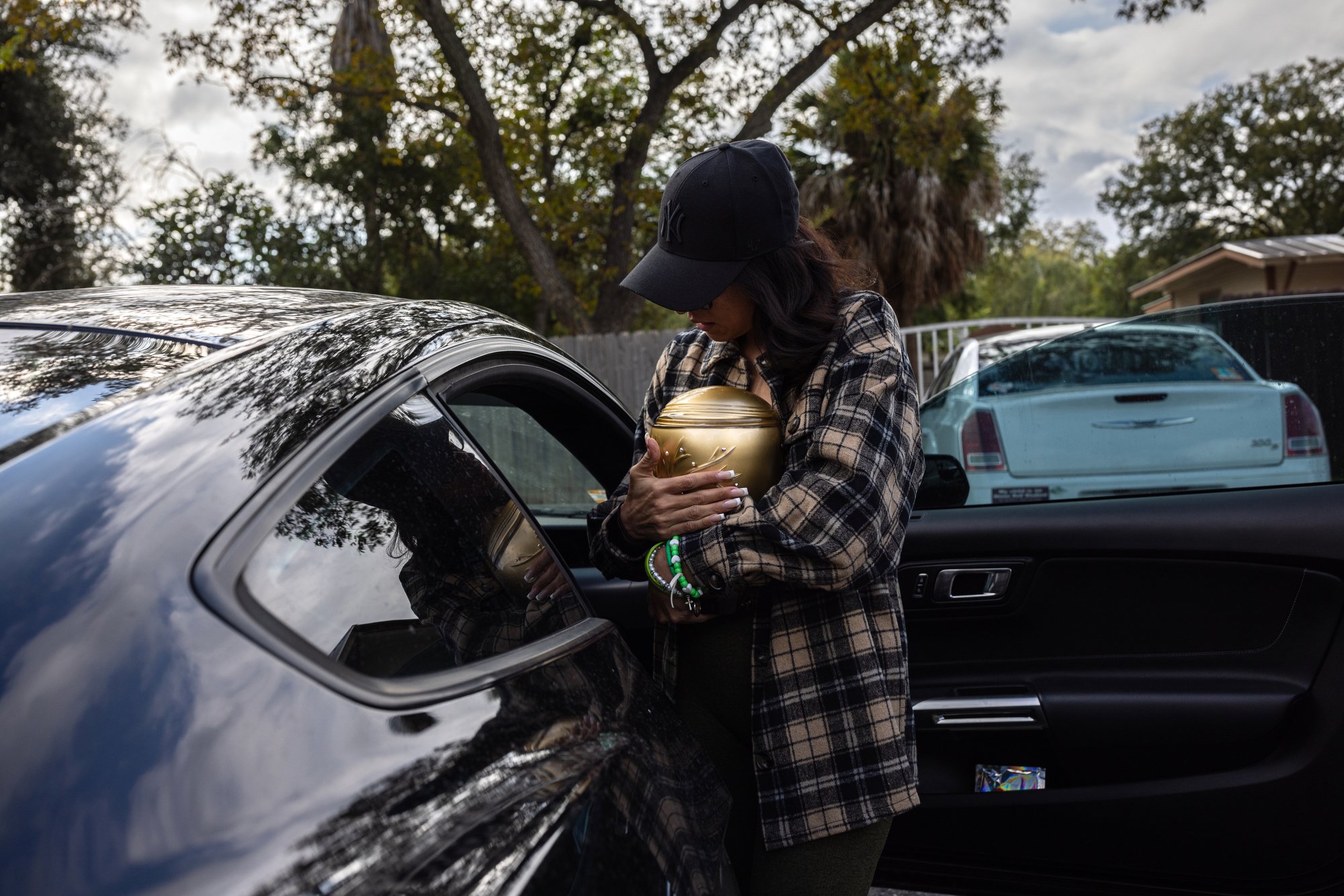  Ana Rodriguez carries the urn containing the ashes of her daughter, Maite, 10, who was killed in the mass shooting at Robb Elementary School, on her way to Hillcrest Memorial Cemetery in Uvalde, Texas, to celebrate Maite’s life and observe the Day o