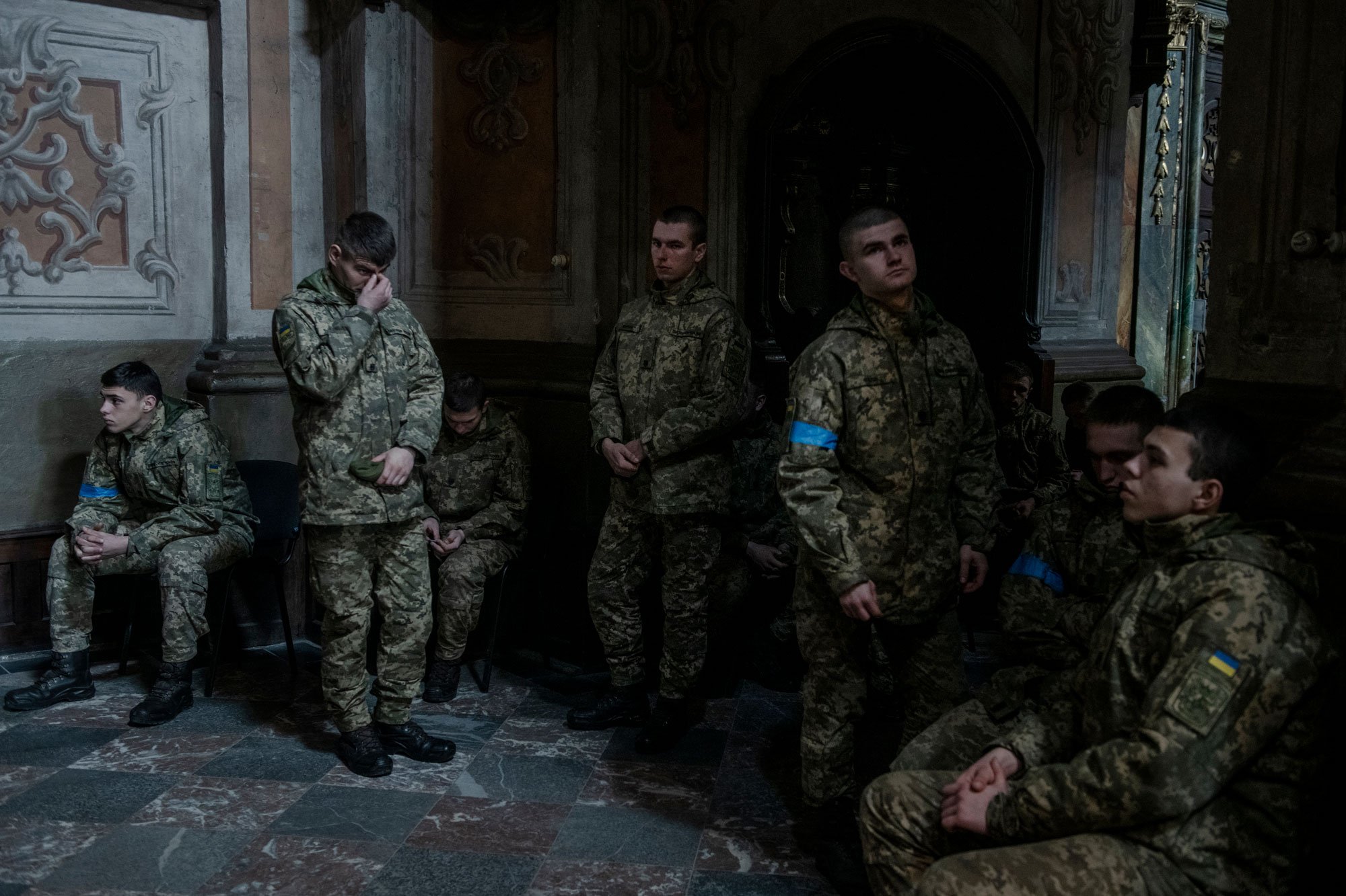  Young military volunteers participate in a memorial service in The Cathedral of Most Holy Apostles Peter and Paul in Lviv, Ukraine, March 15, 2022, for victims killed during Russian airstrikes two days earlier at the military base in Yavoriv. 