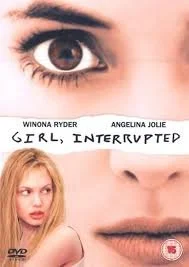 Close-up of a woman's eye, with a DVD cover below showing two women and the title 'Girl, Interrupted'.