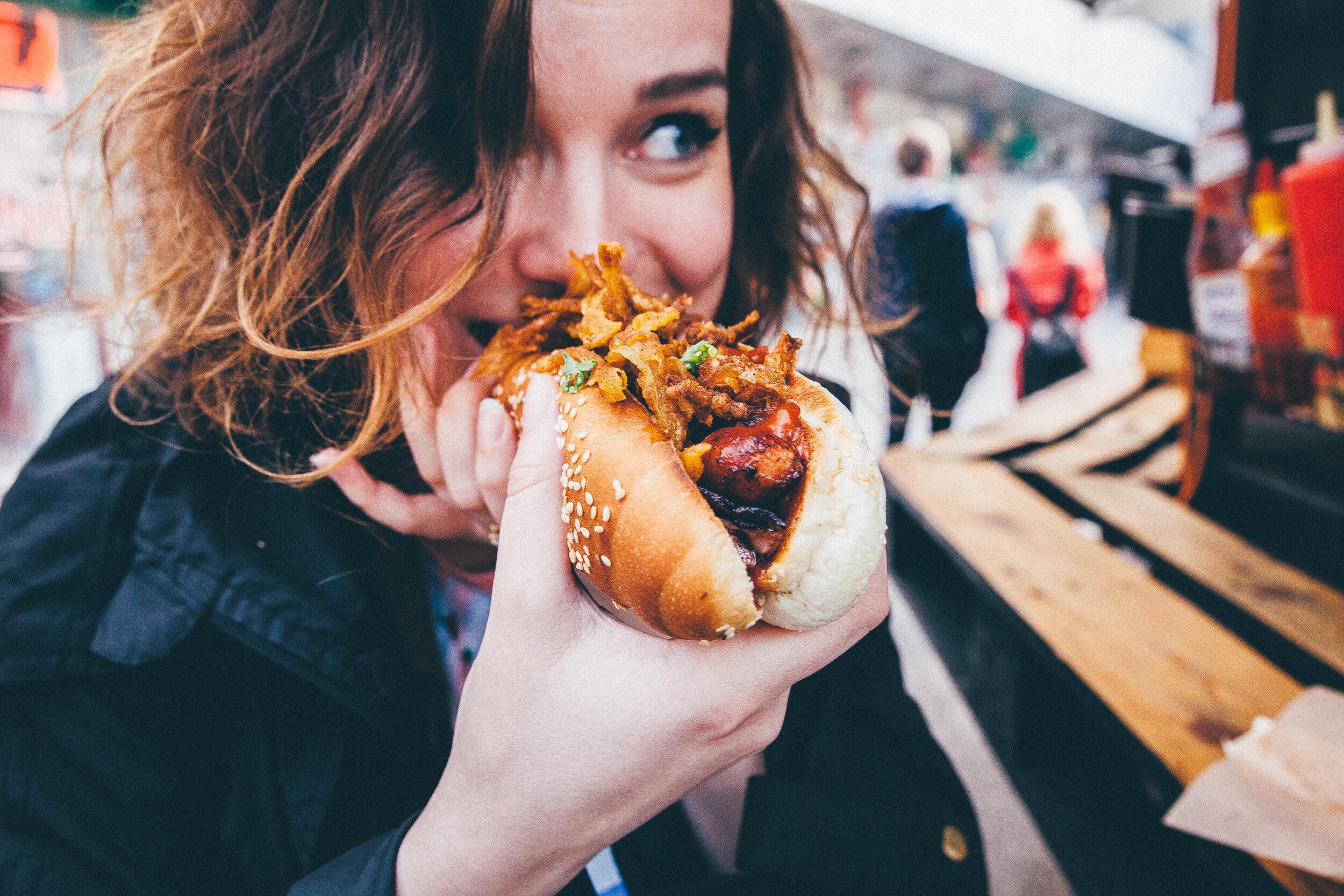 food-holding-street-eating-woman-takeaway-junk-food-hot-dog-street-food-to-go_t20_nePlBg (1) (1).jpg