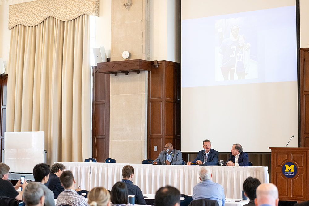  From left: Darryl Conway, Denny Kellington, and Dr. Jim Ellis present on lessons learned from the Damar Hamlin case. 