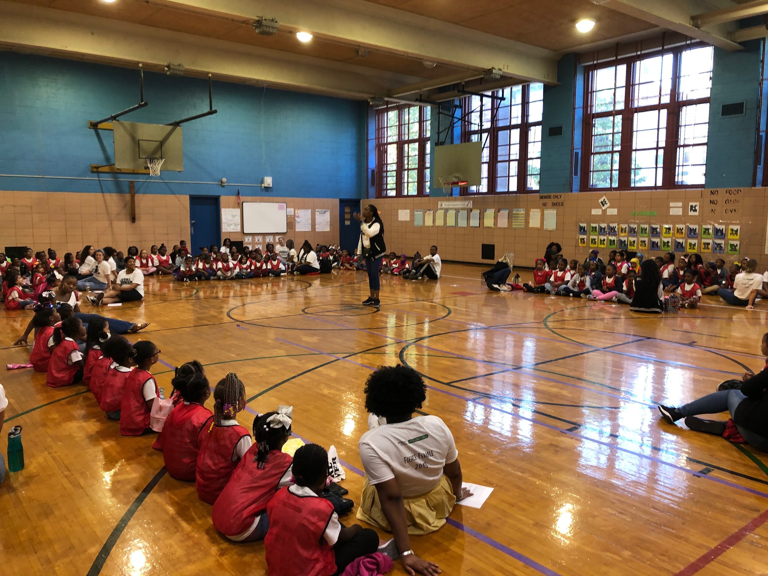  Principal Nikki Bowen addresses the students at Excellence Girls on the last day of school, June 2019. 