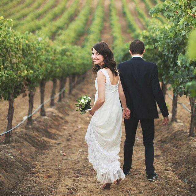 A landscape of love in the midst of lush vineyards .
.
.
.
.
#wildandgolden #eephotography #erinwoolsey #lightinspired #ohwowyes #dearphotographer #dfwweddingphotographer #vineyardwedding #brideandgroom #weddingfun #subject_light #thehonestcapture #l