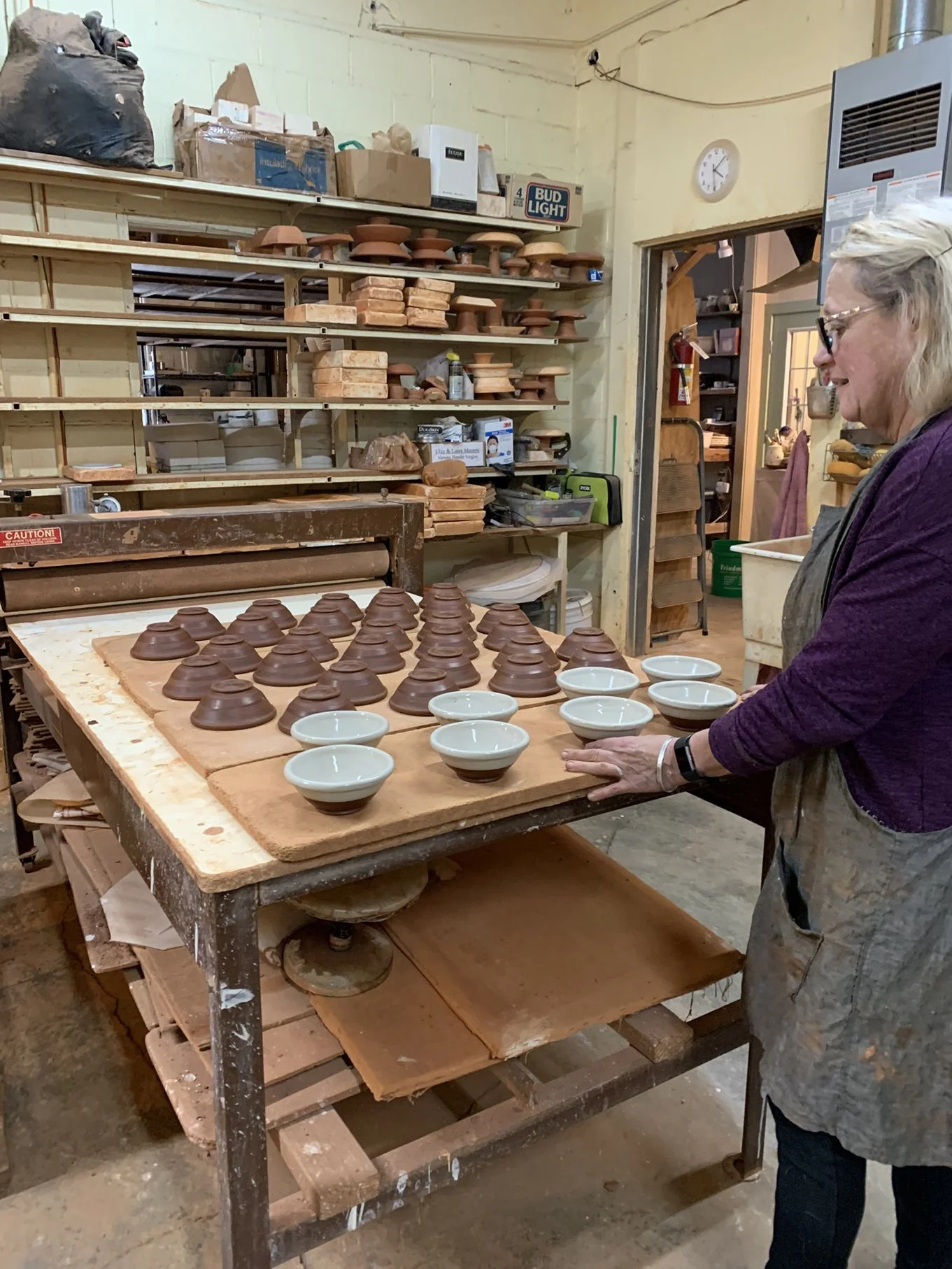 Jan working on slipping Tiny Bowls