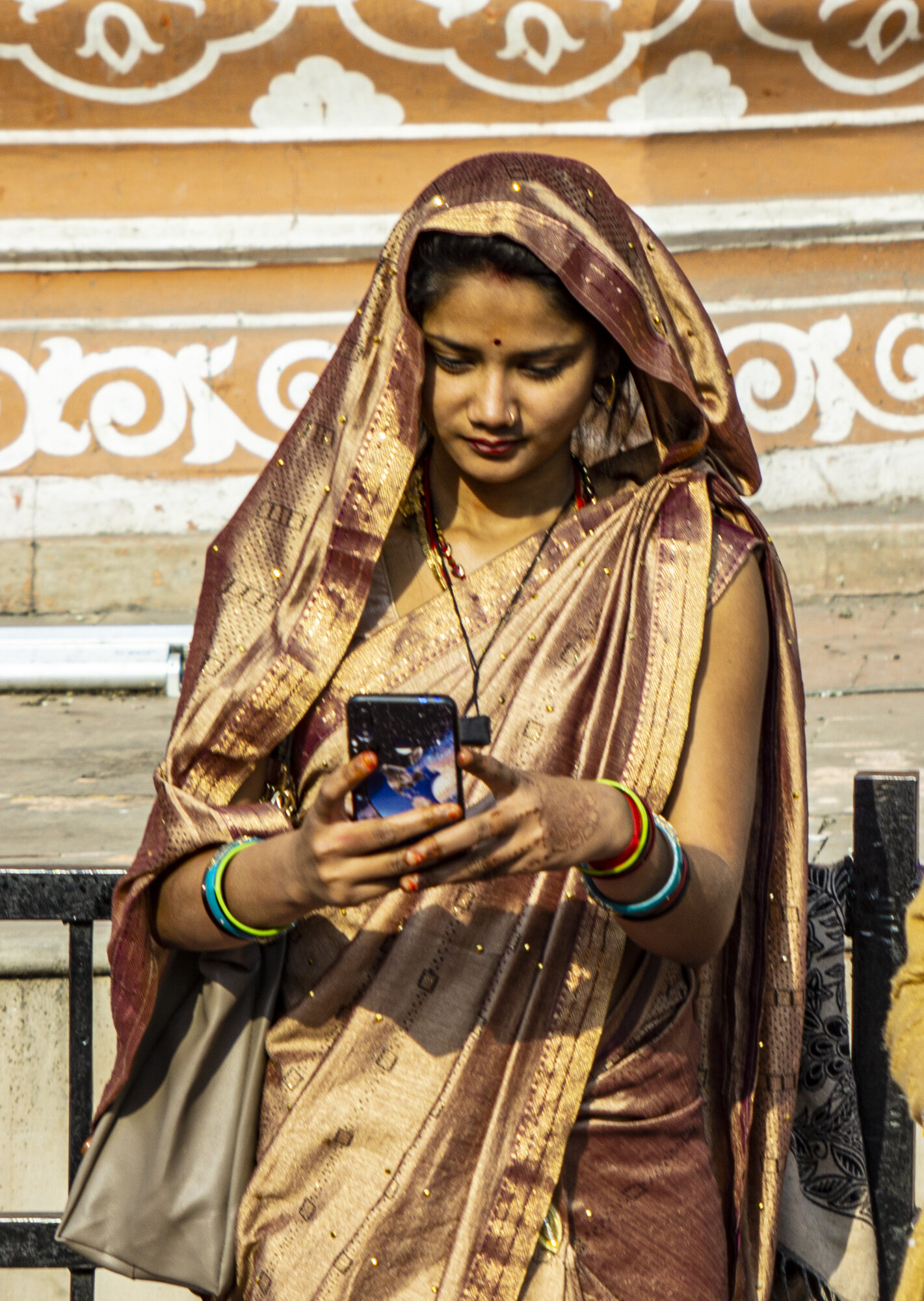 Young Indian Woman on iPhone