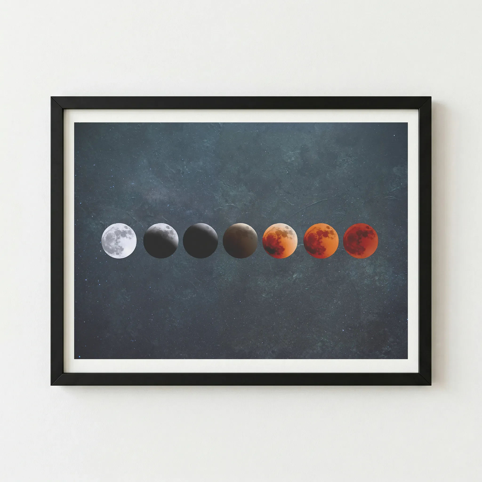 The 'Waning Into Red' celestial artwork in a black wooden frame, providing a dark, seamless border that accentuates the deep teal cosmic background.