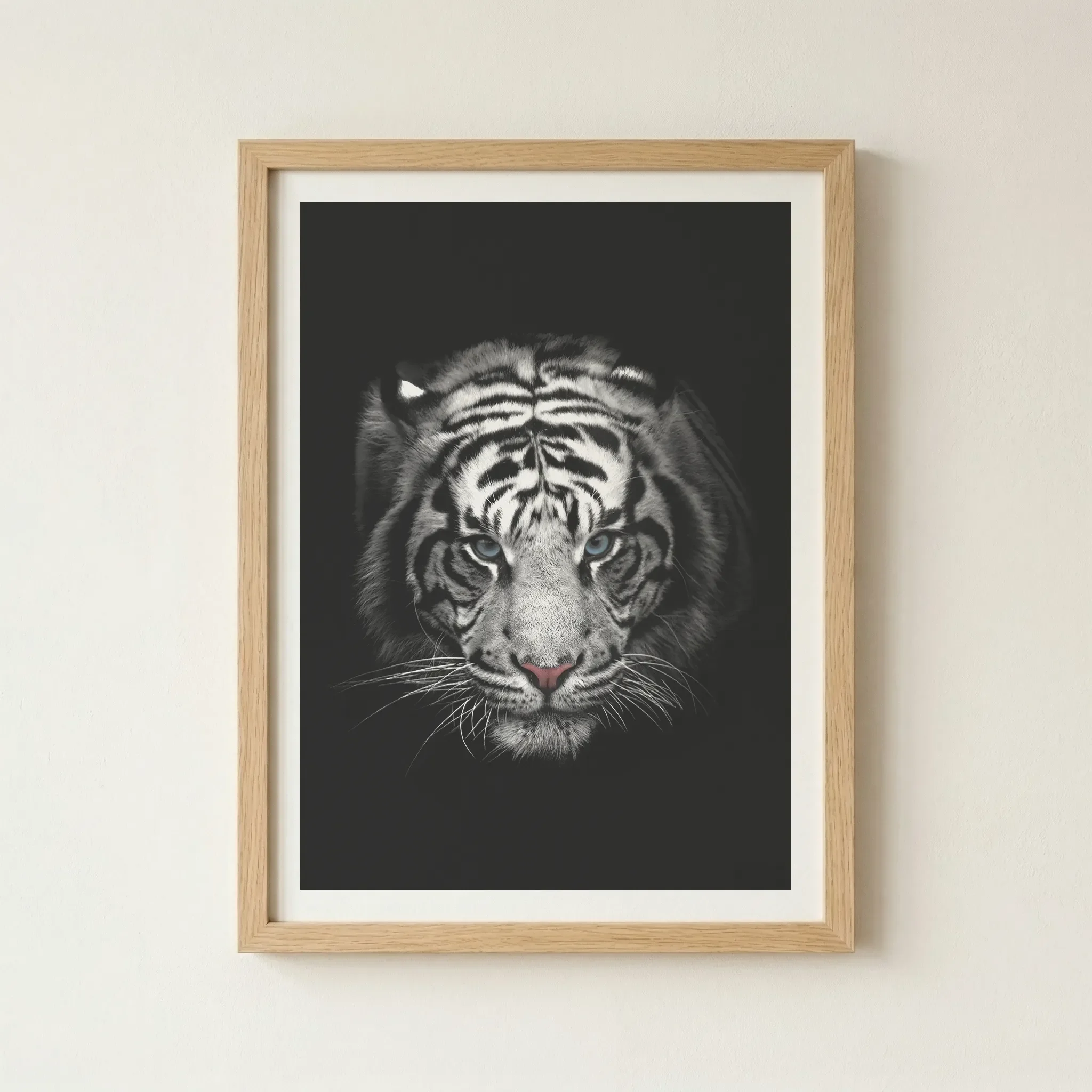 'White Tiger' print in a natural wood frame, adding an organic warmth to the cool tones of the tiger's white fur and blue eyes.