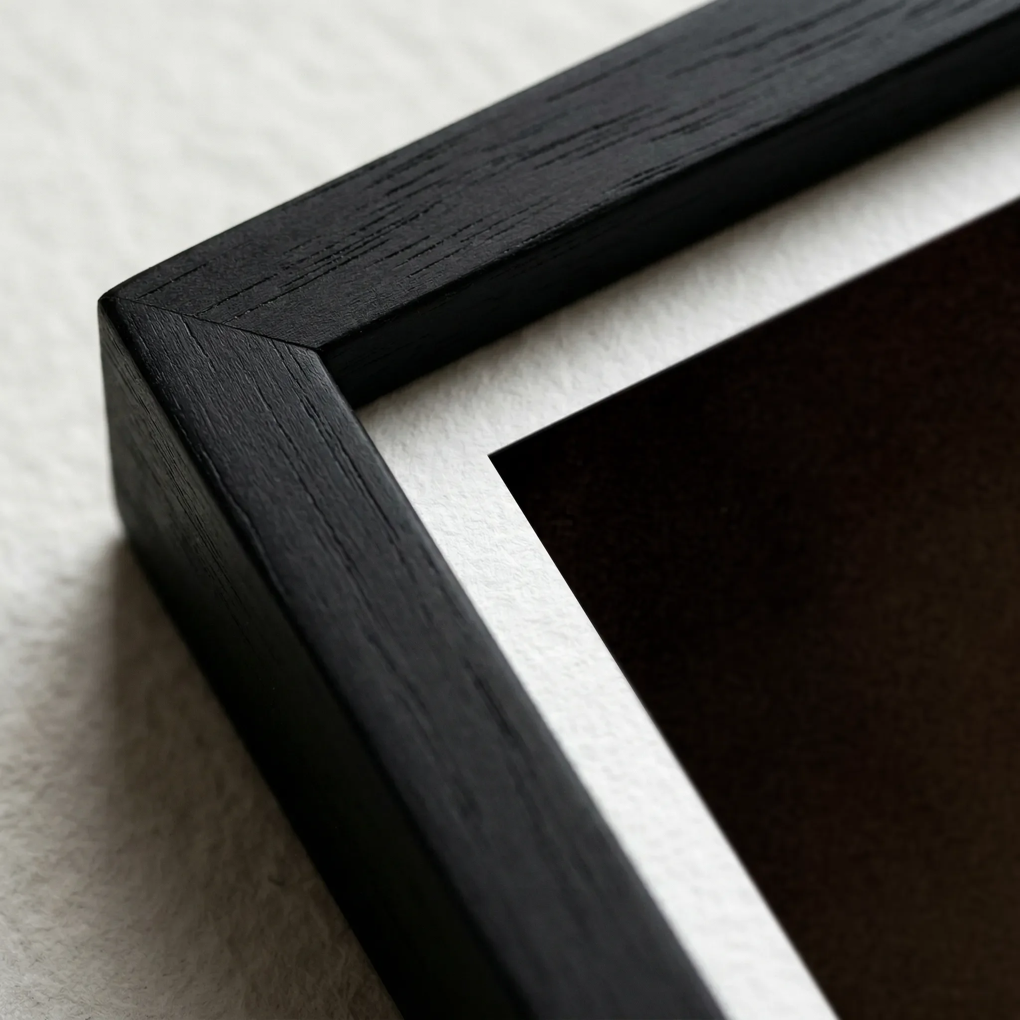 Fear Black Frame Micro Close up  which intensifies the dark, moody aesthetic and provides a seamless, immersive border for the shadows.