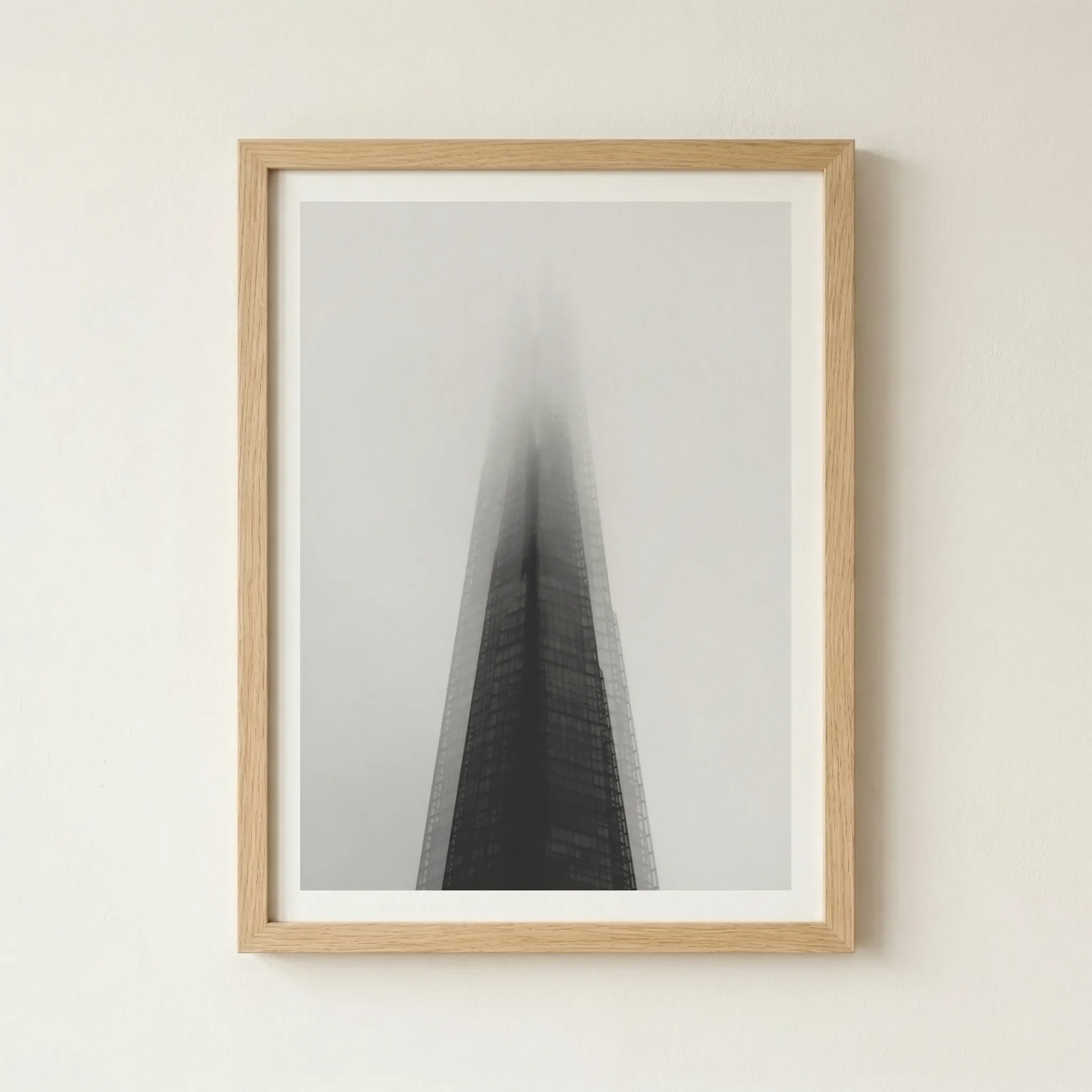 'The Dark Tower' in a natural wood frame, adding a touch of organic warmth to the cool, industrial tones of the architectural study.