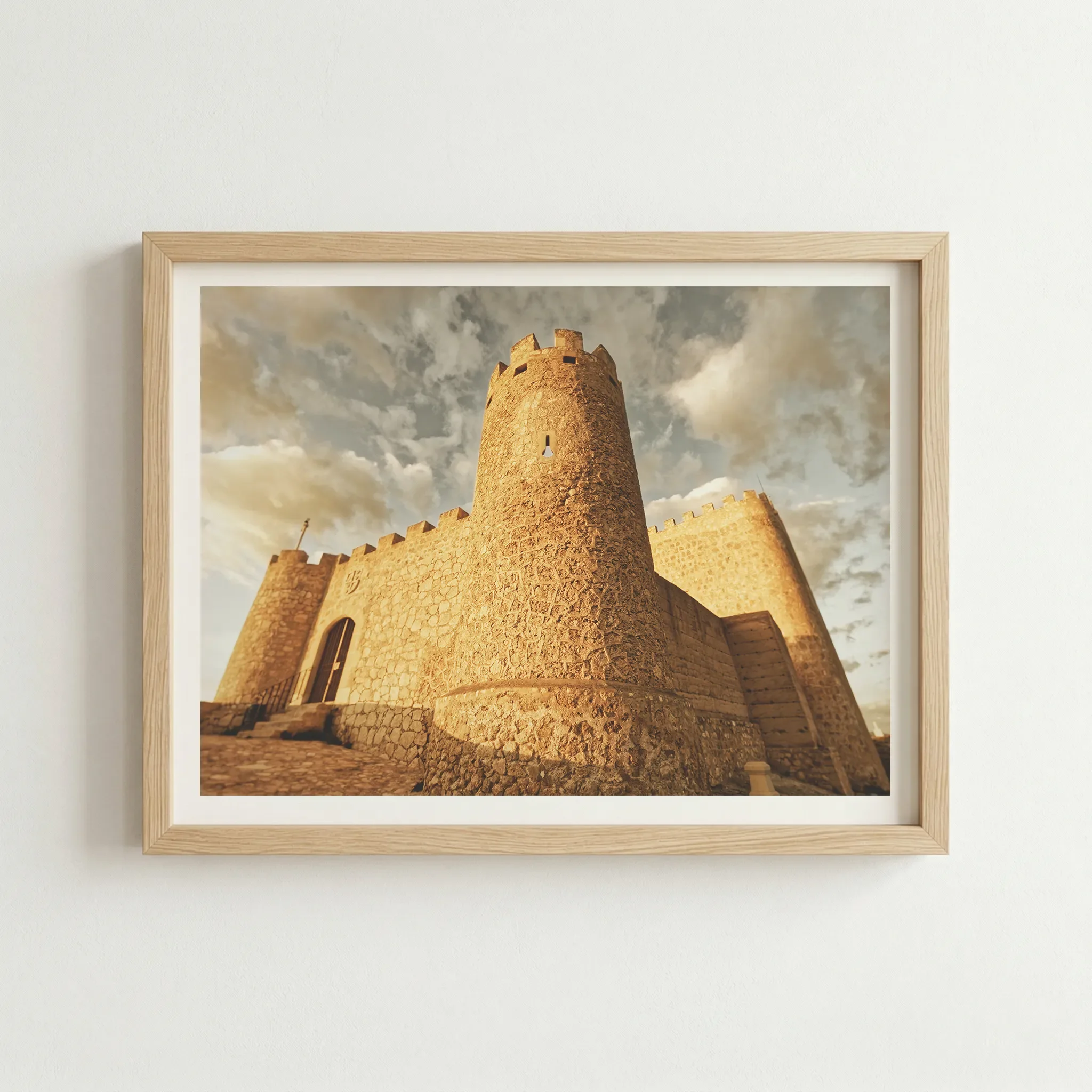 Castillo de Jumilla fine art print in a natural wood frame, grounding the historic Mediterranean architecture with an organic, earthy finish.