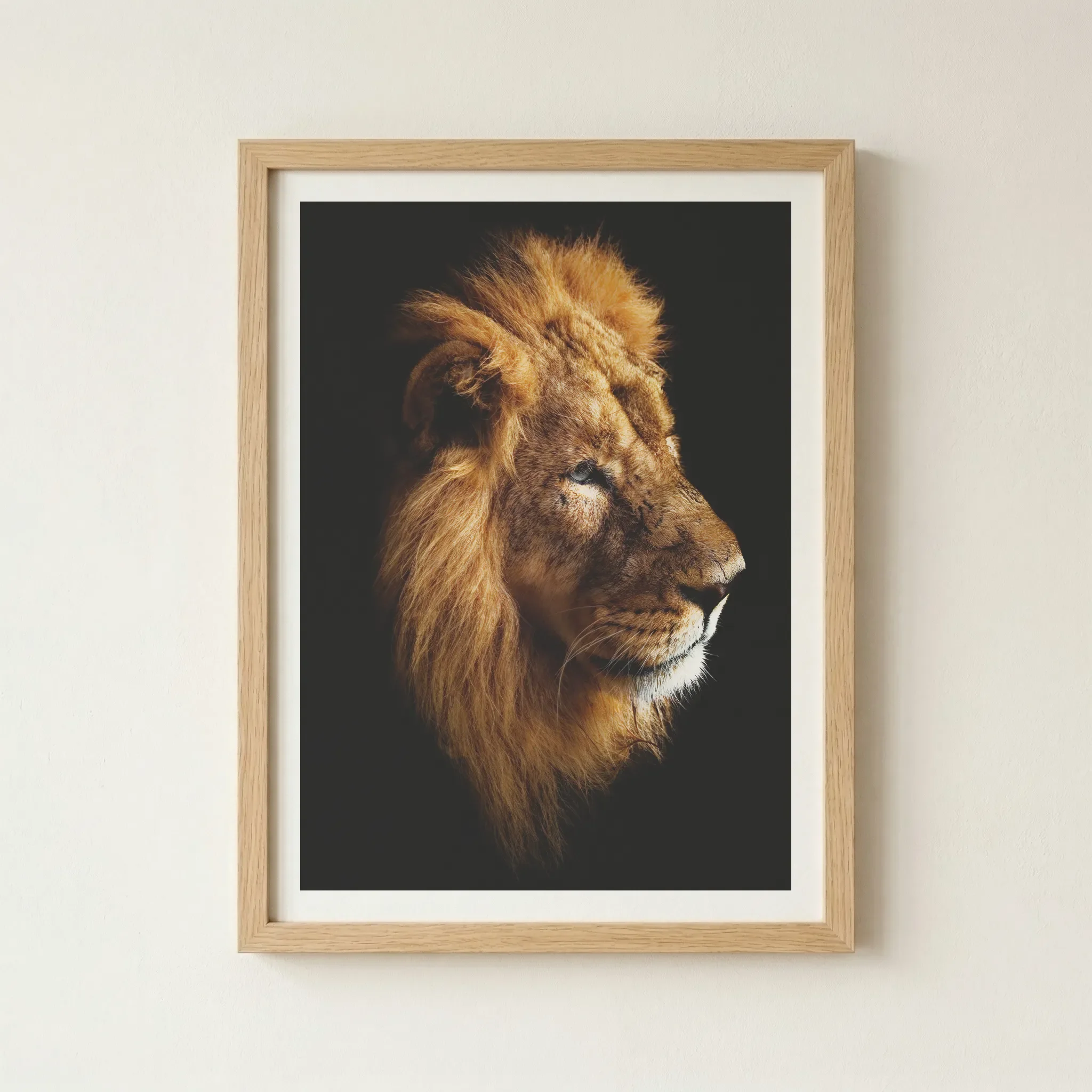 'Lion' print in a natural wood frame, adding an earthy, organic element that reflects the lion’s natural environment and noble spirit.