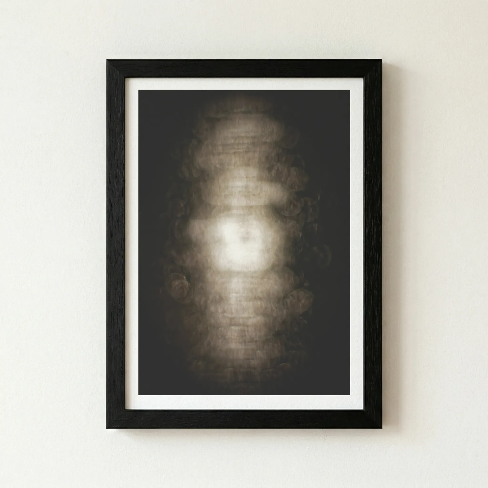 The 'Cocoon' abstract artwork in a black wooden frame, enhancing the deep shadows and the mysterious, atmospheric mood of the piece.