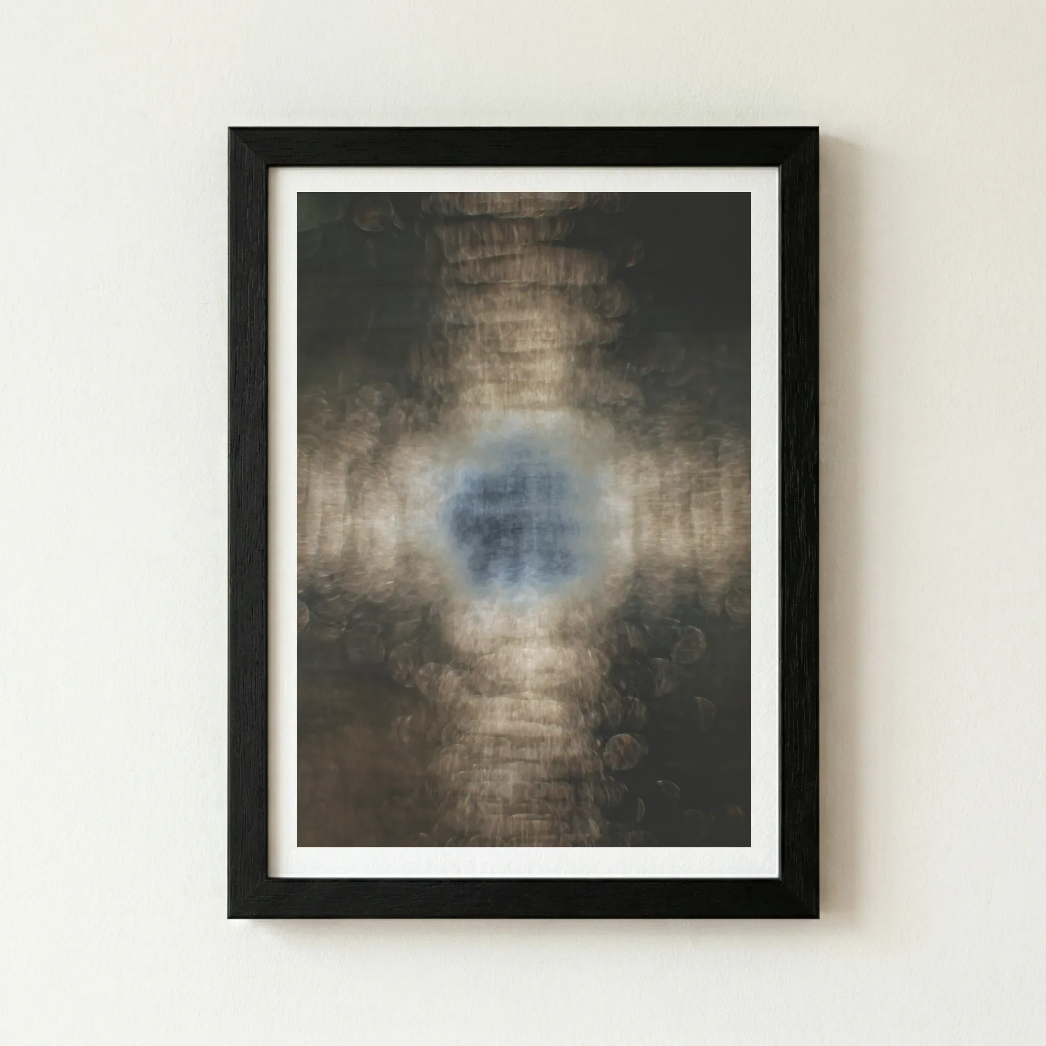 The 'Evolution' print in a black wooden frame, which grounds the deep, moody background and makes the golden "core of being" appear intensely luminous.