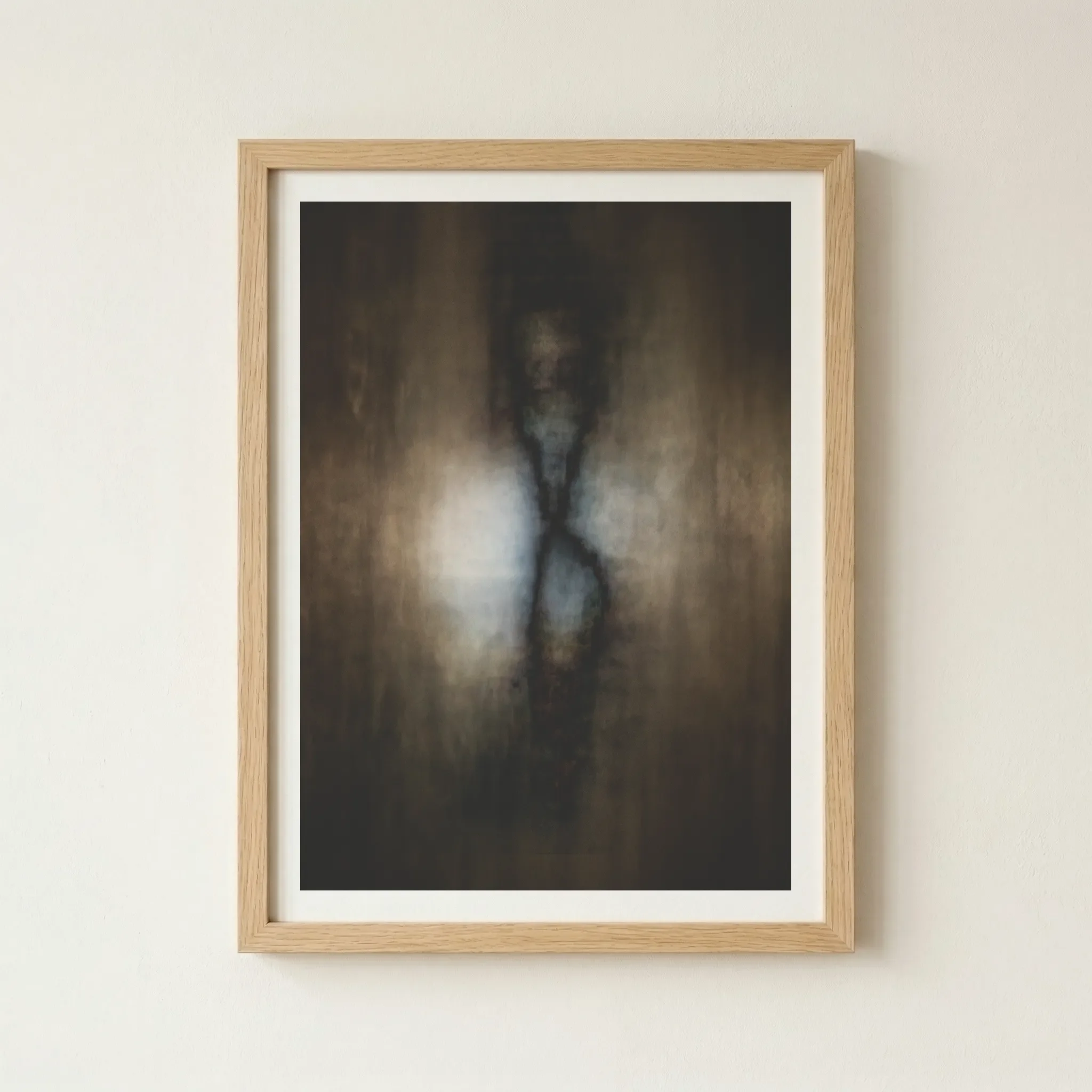 'Cocoon' butterfly print in a natural wood frame, grounding the abstract, ethereal energy with an organic, earthy finish.
