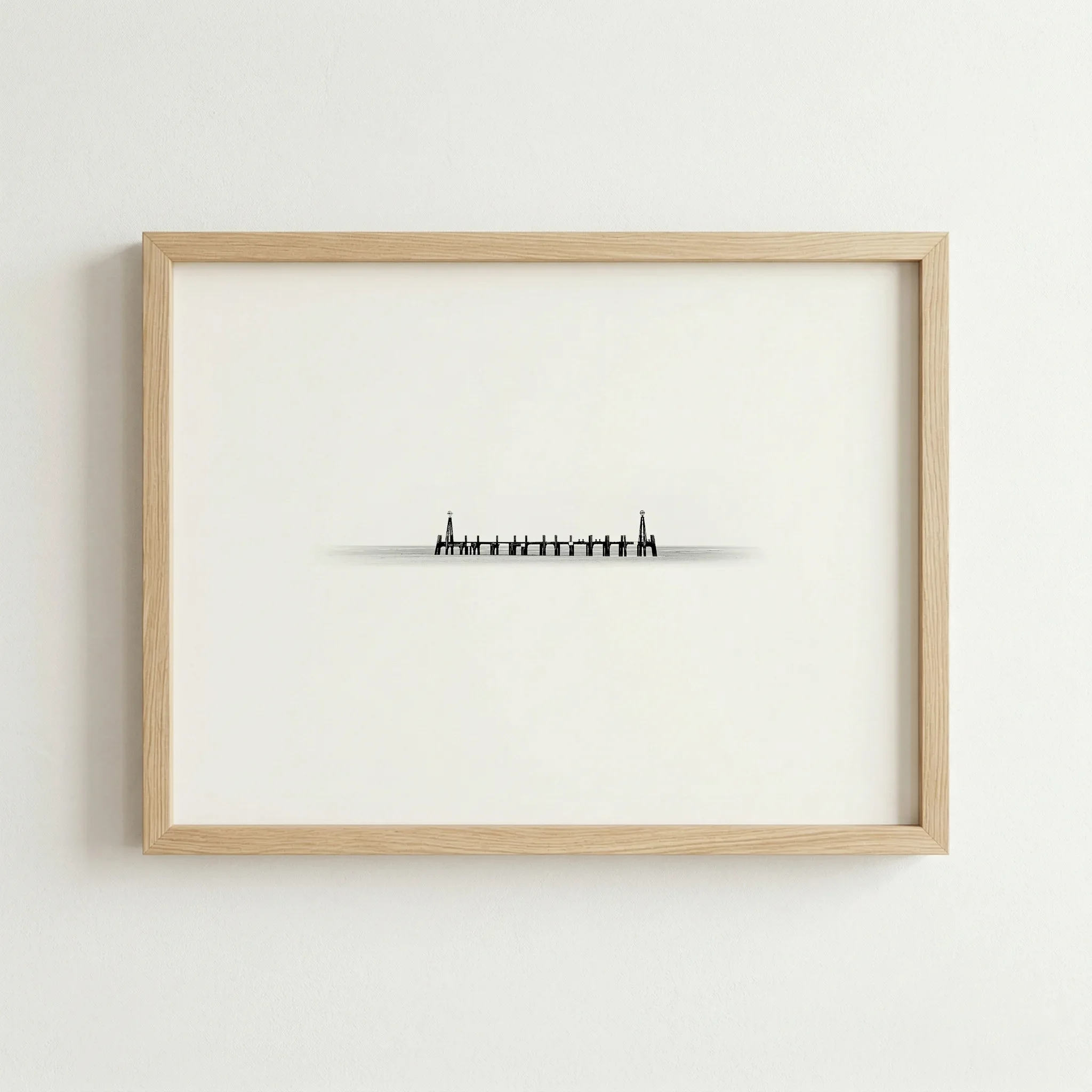 The minimalist pier print in a natural wood frame, adding organic warmth to the industrial silhouette.