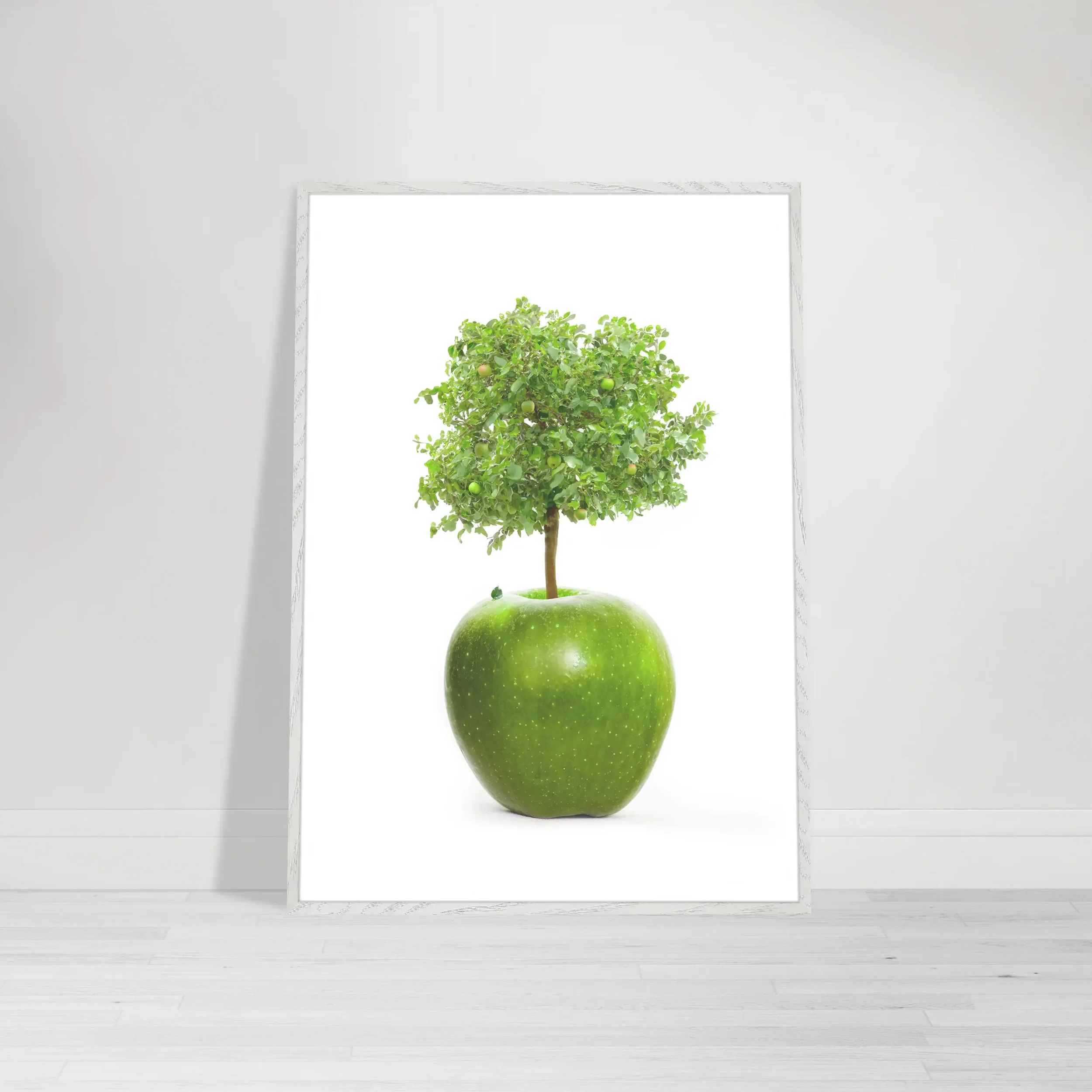 Fine art print of a tree growing out of an apple on a white background – a symbolic image representing growth, wisdom, and transformation in a white frame wall art print