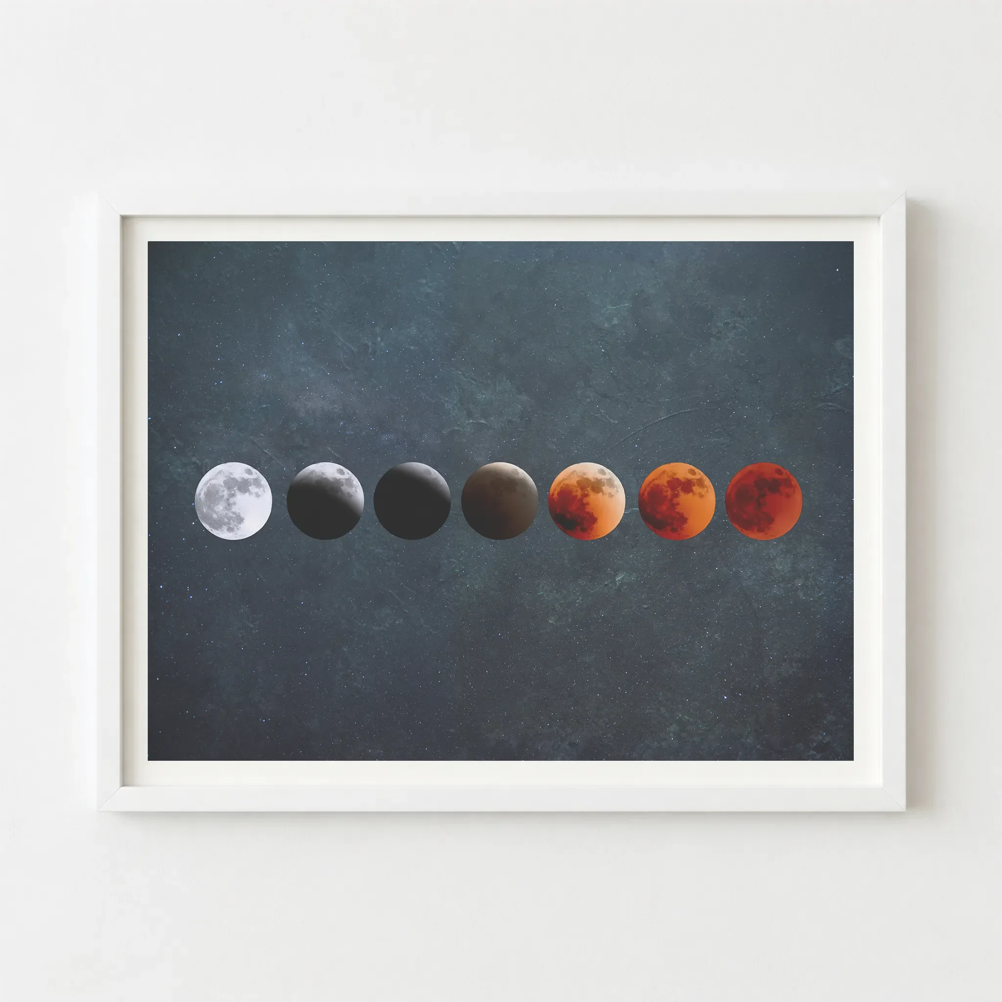 Lunar eclipse phase artwork in a white frame, creating a crisp, modern contrast against the deep crimson and dark celestial tones.