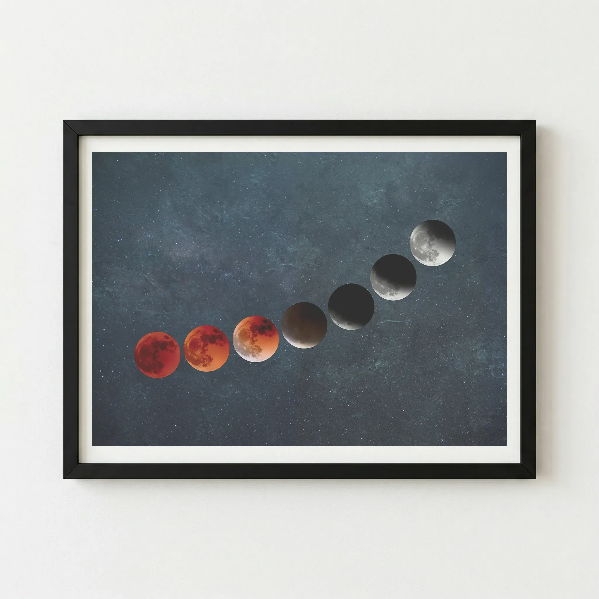 The 'Blood Moon' eclipse artwork in a black wooden frame, providing a dark, seamless border that enhances the cosmic teal background.