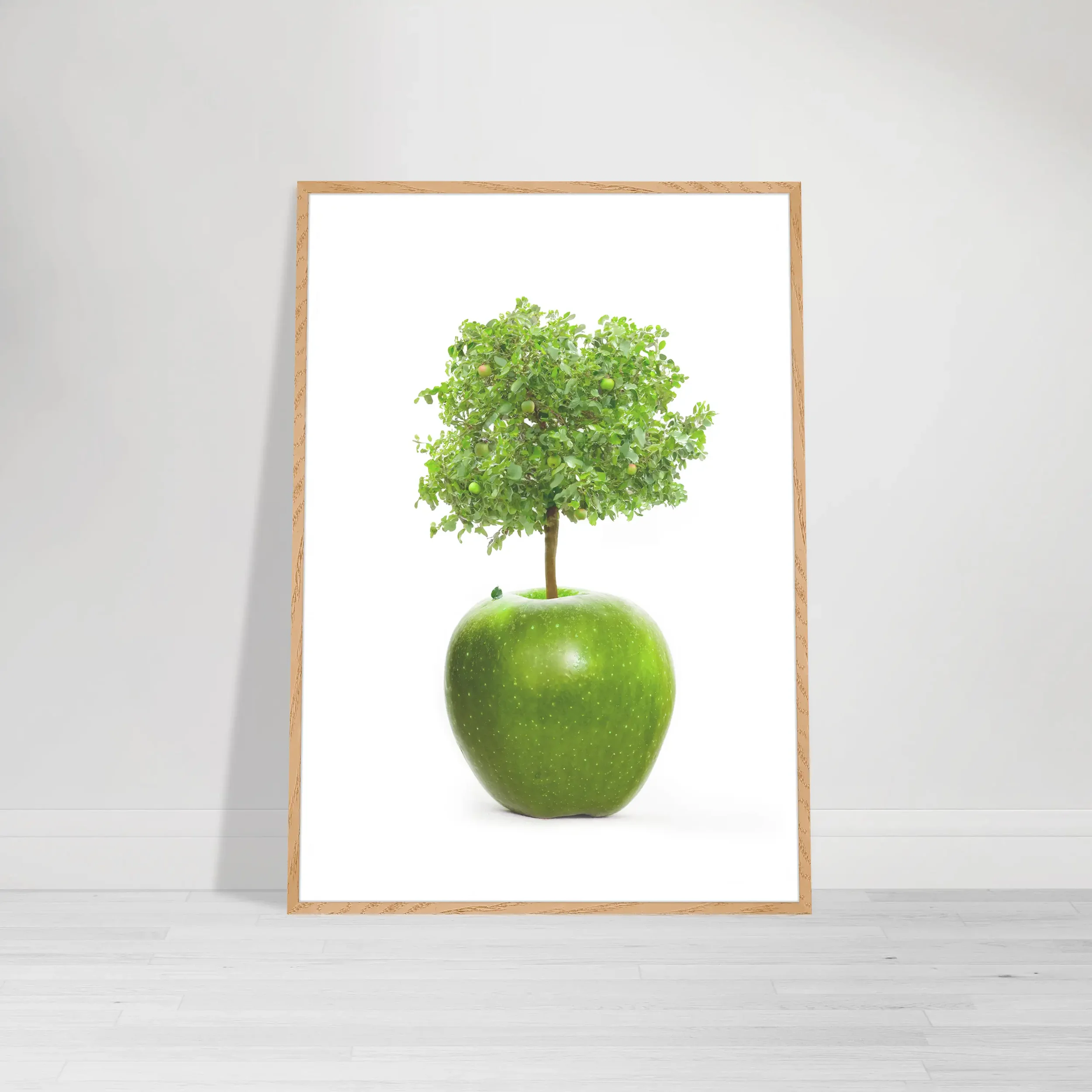Fine art print of a tree growing out of an apple on a white background – a symbolic image representing growth, wisdom, and transformation in a wood frame wall art print
