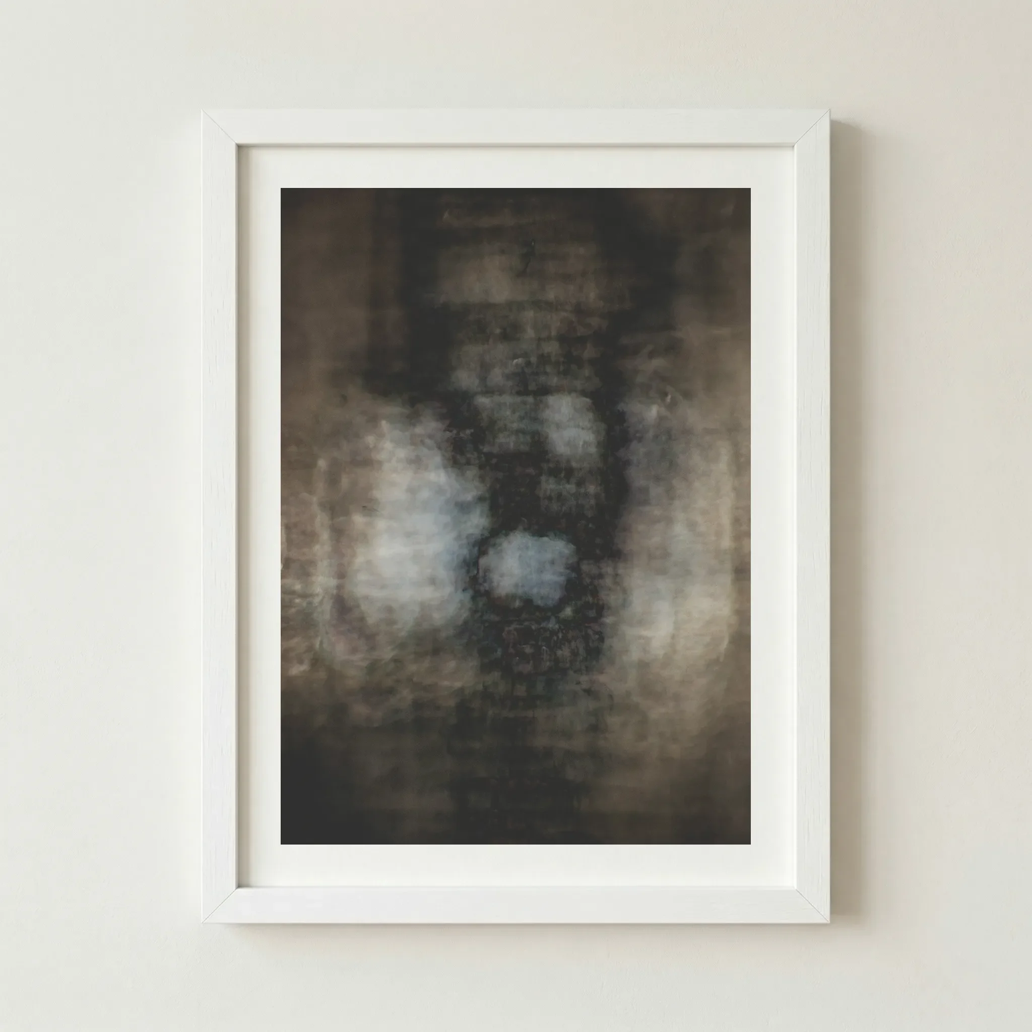 Abstract 'Fear' print in a white frame, creating a stark, modern contrast that makes the central pale light appear more isolated and vulnerable.
