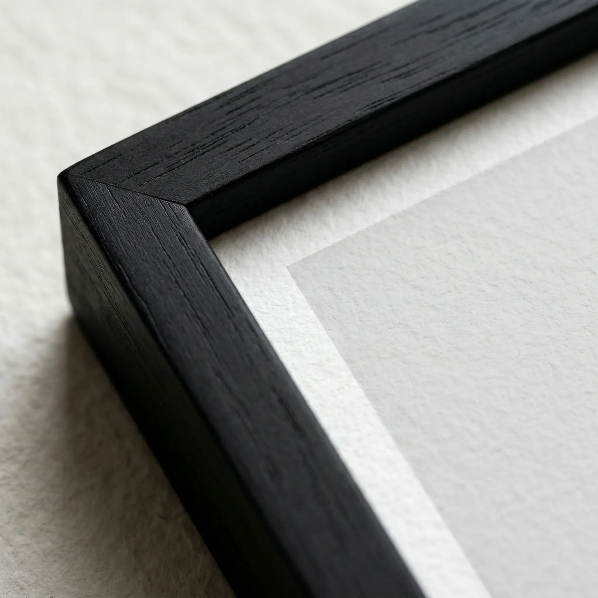 The Dark Tower Black Frame Micro Close up. 'The Dark Tower' print in a black wooden frame, enhancing the dramatic shadows and providing a bold, modern boundary for the misty London skyline.