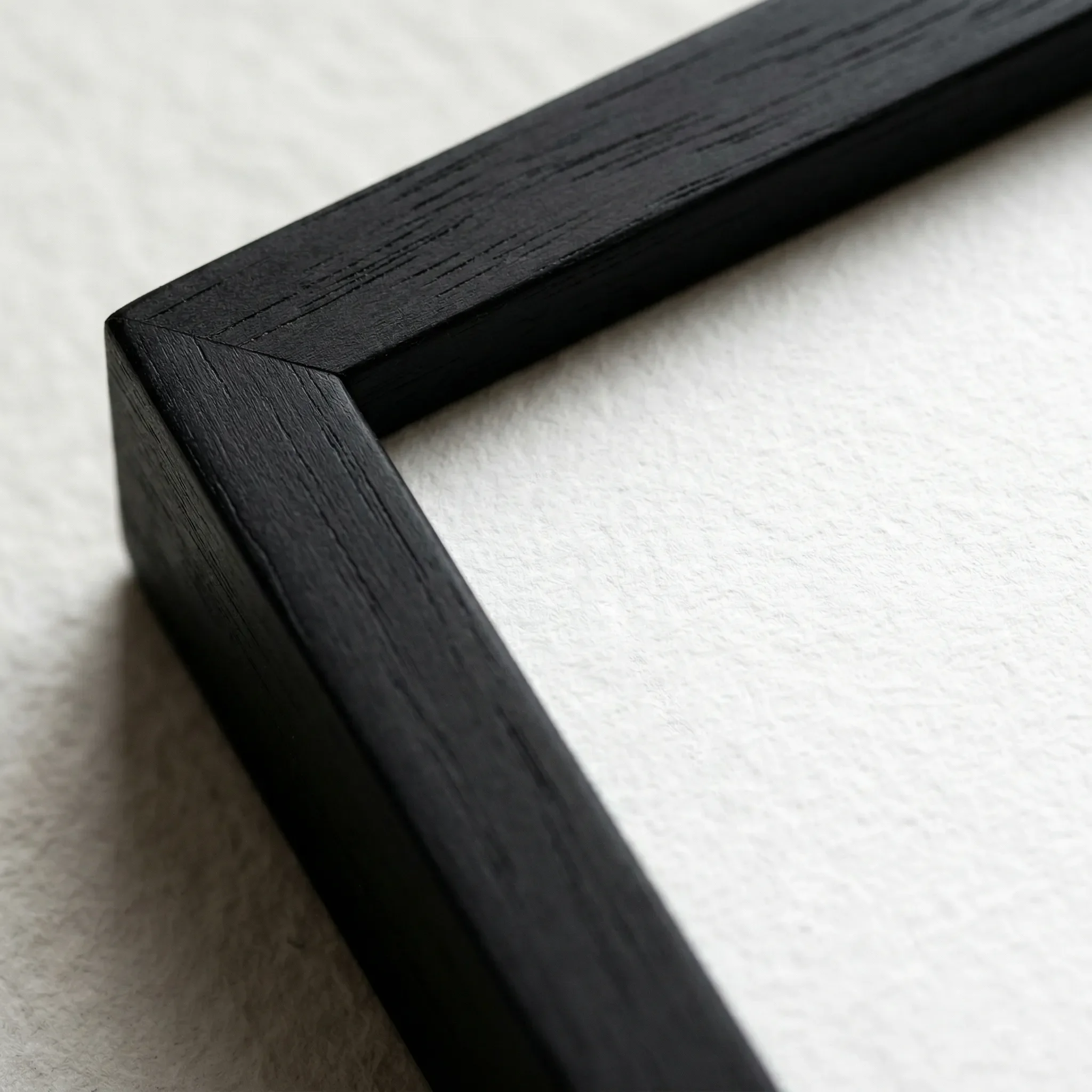 The 'Nina Simone' fine art print in a Close up black wooden frame, providing a sharp, classic border that anchors the vibrant yellow tones of her headwrap.
