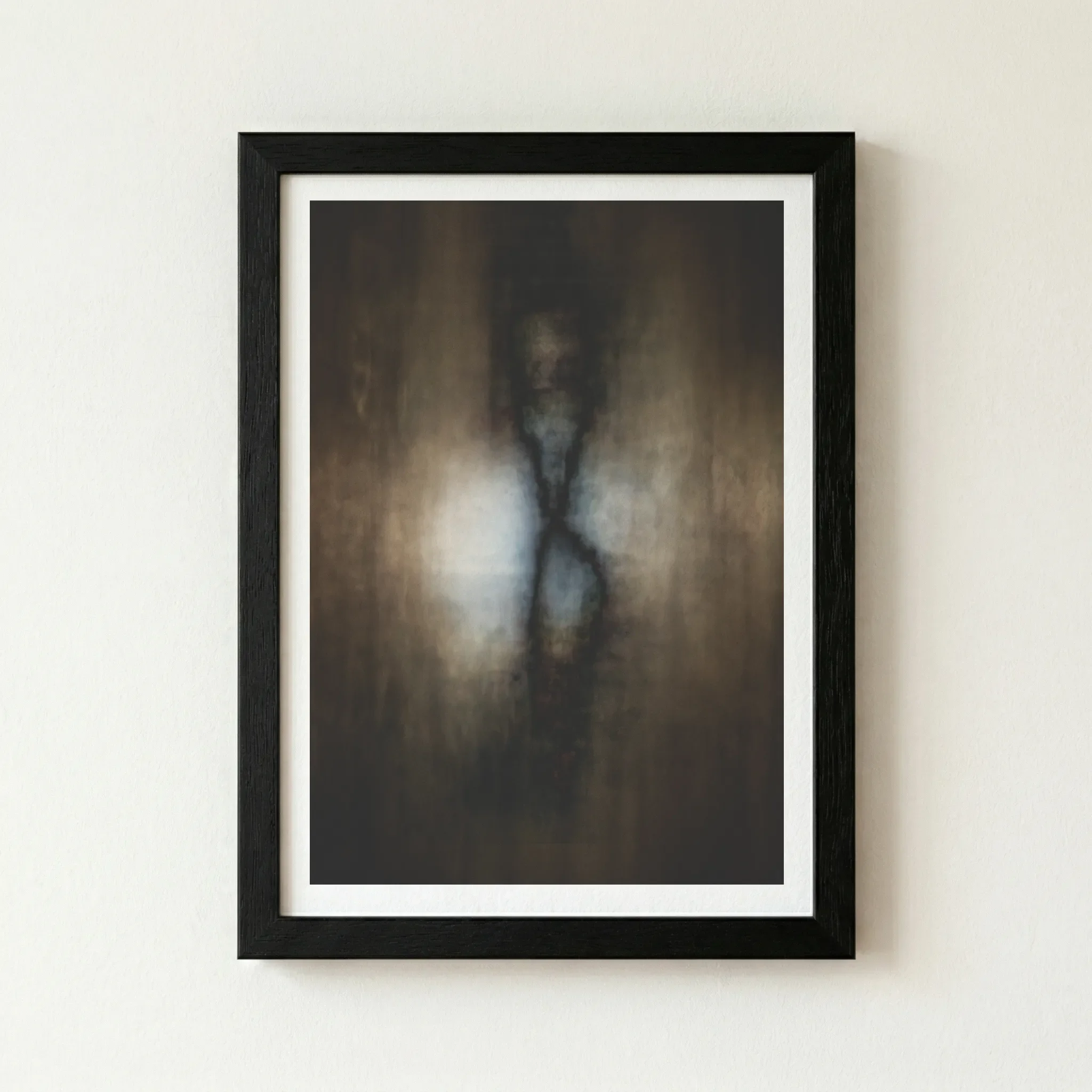 The 'Cocoon' butterfly artwork in a black wooden frame, enhancing the deep shadows and the mysterious, atmospheric mood of the piece.