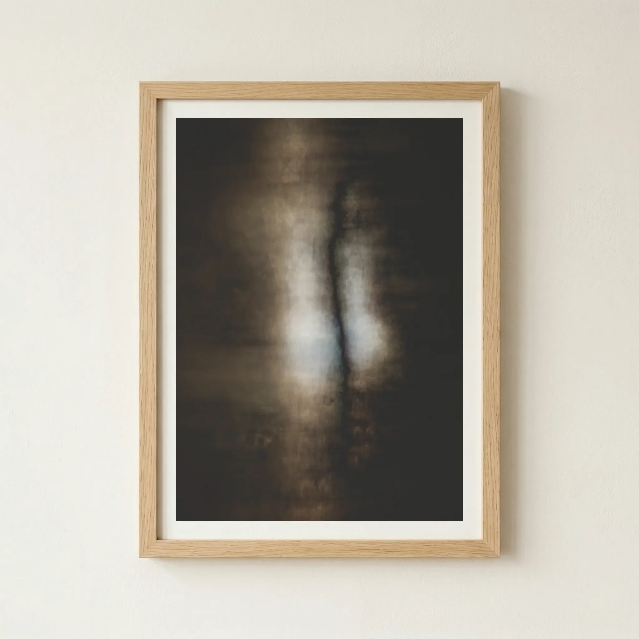 'Creation' fine art print in a natural wood frame, grounding the ethereal, high-concept imagery with a warm, organic texture.
