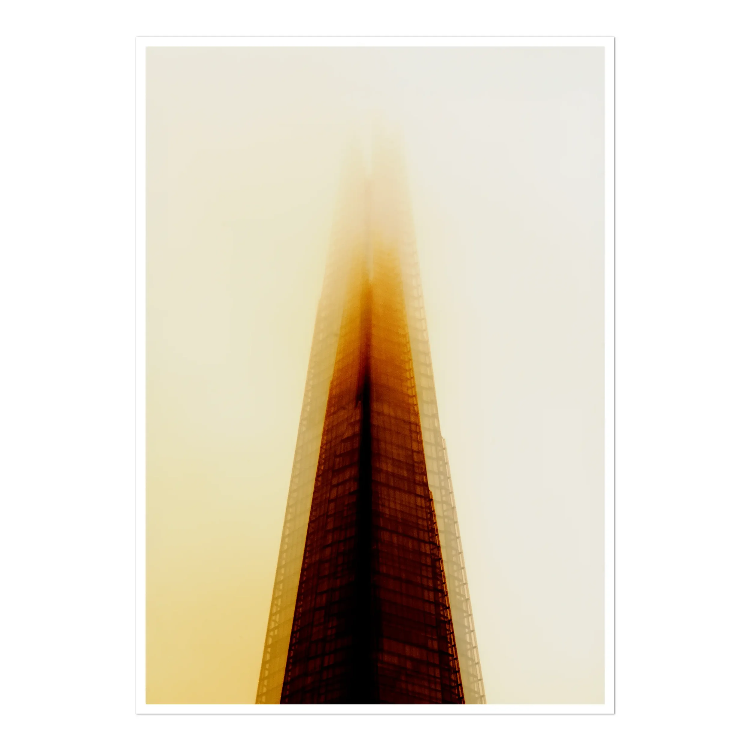 A glowing, atmospheric fine art photograph of The Shard in London, captured in warm golden and amber tones as it rises through a thick, luminous fog.