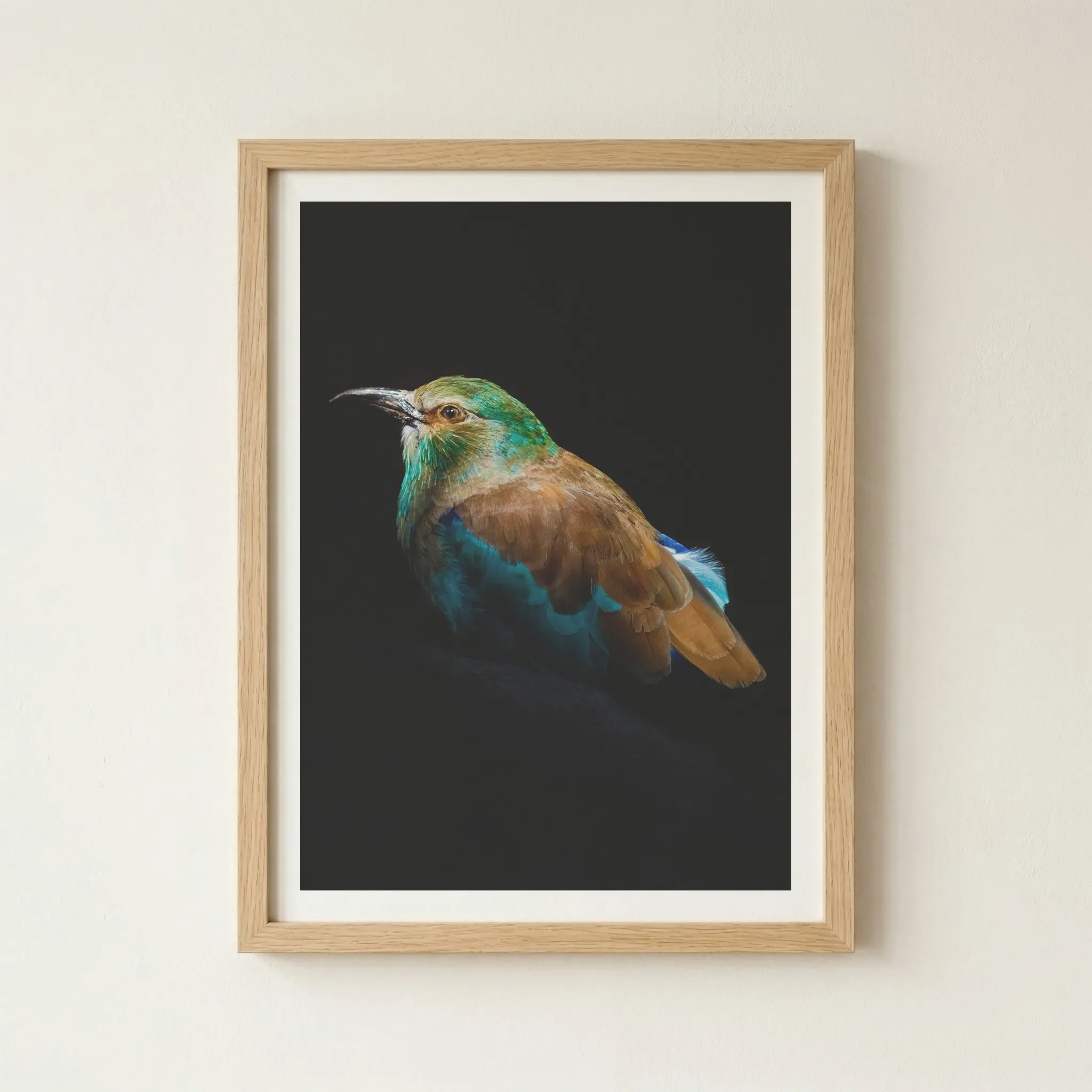 'European Roller' print in a natural wood frame, adding an organic, earthy element that complements the bird's natural cinnamon-coloured feathers.